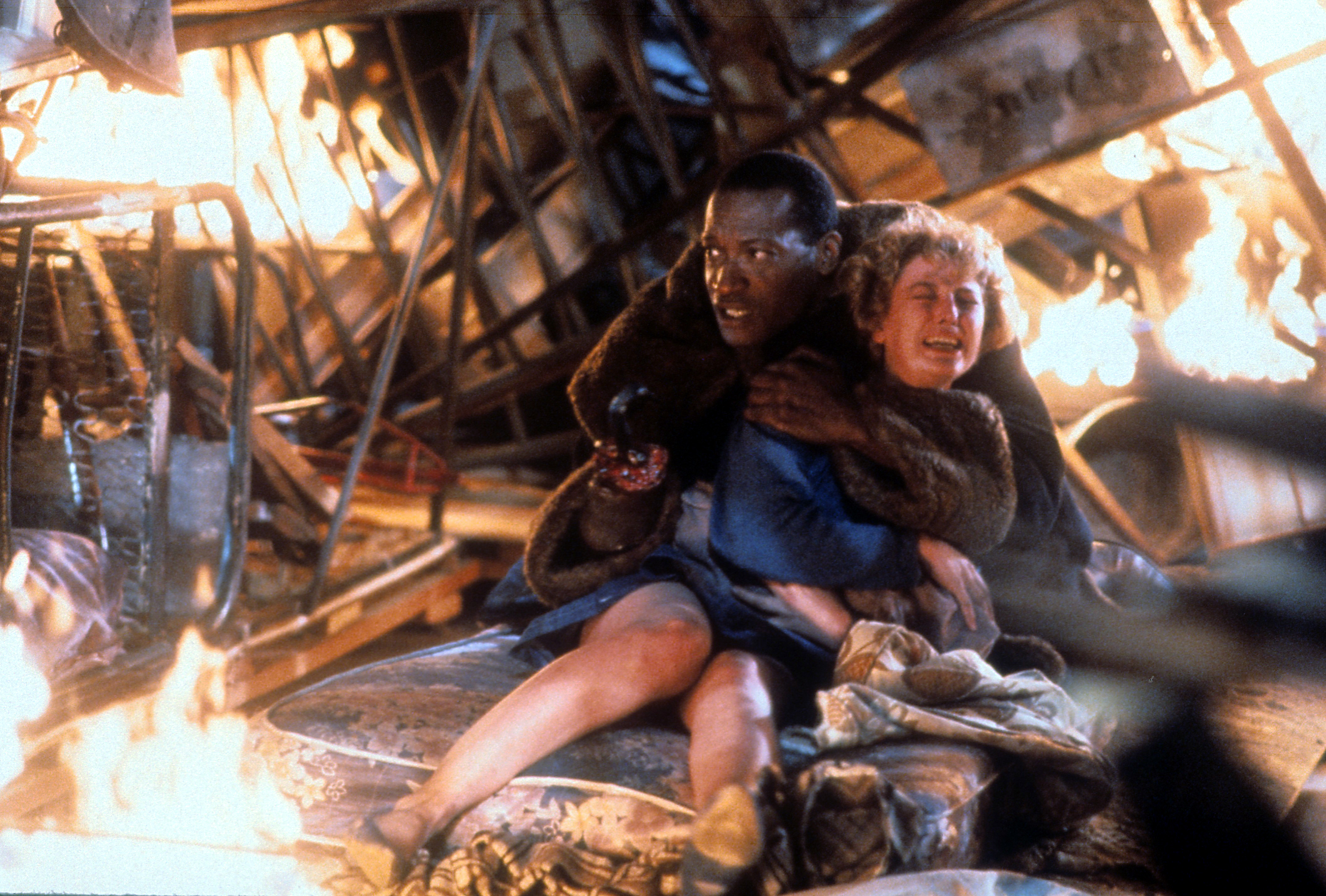 Tony Todd holding onto Virginia Madsen in Candyman 1992