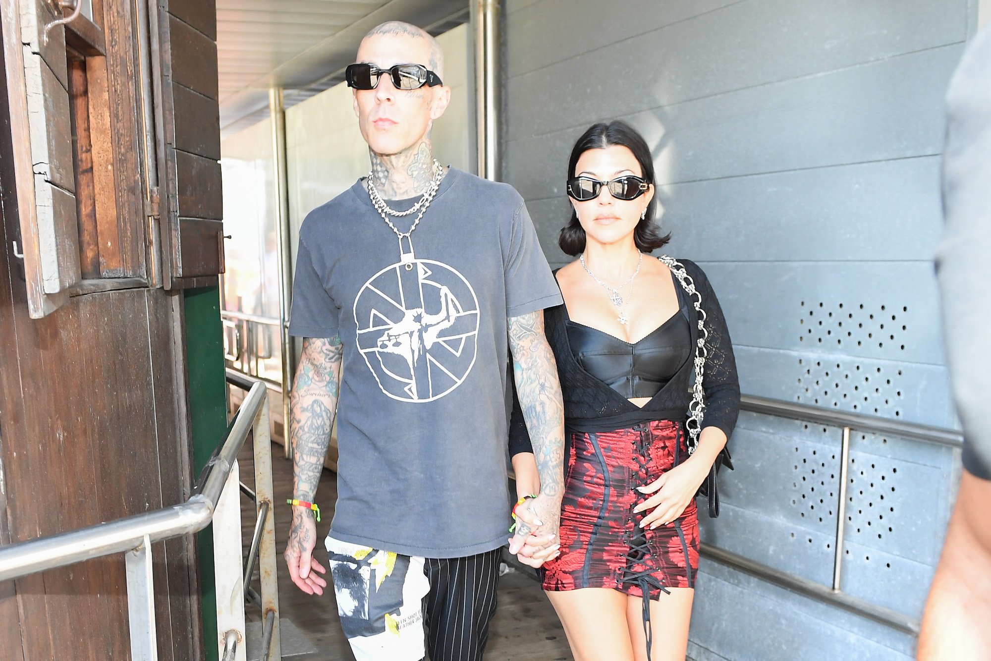 Travis Barker and Kourtney Kardashian walking around Venice, Italy
