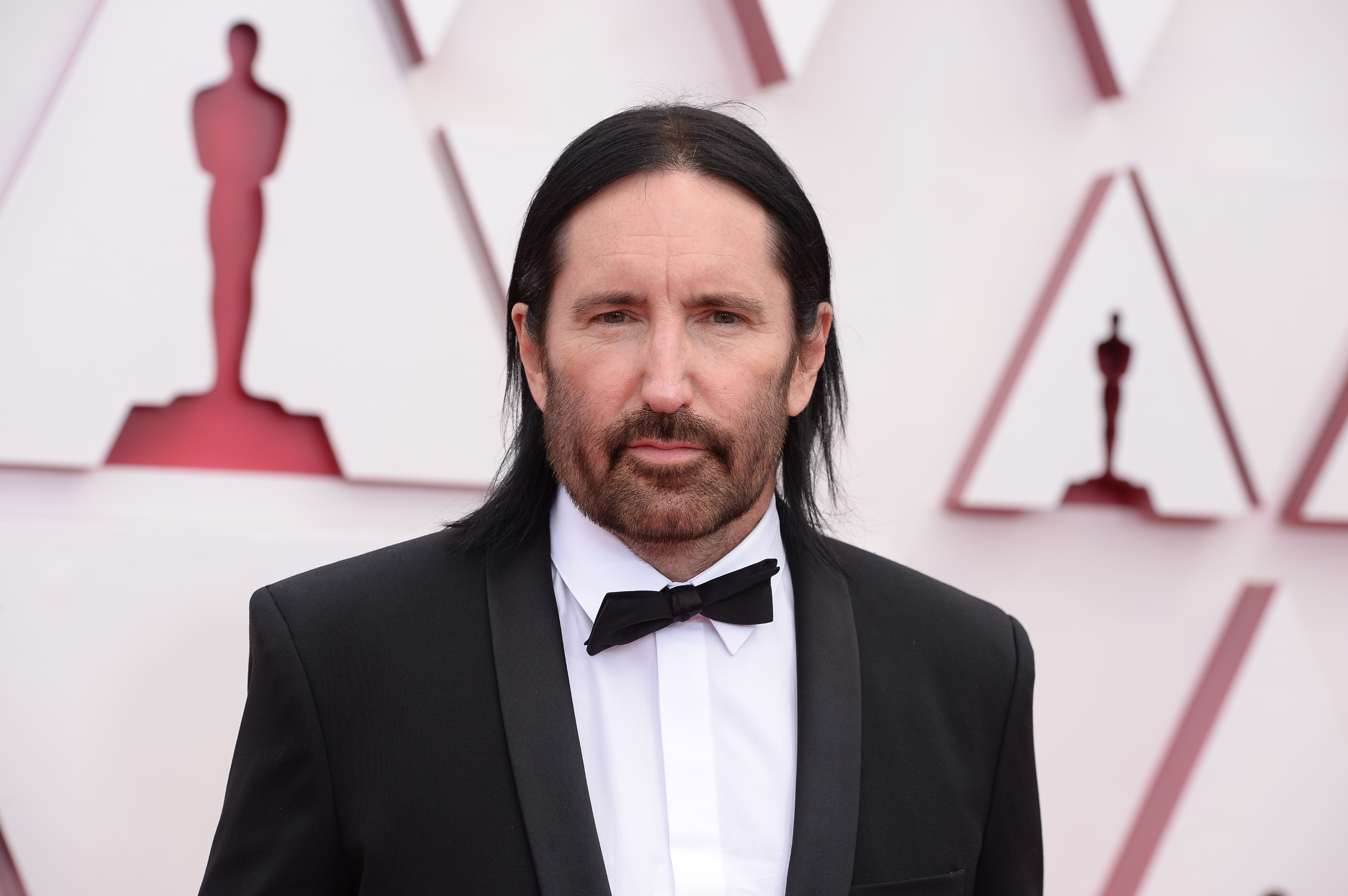 Trent Reznor looks into the camera while attending the 2021 Academy Awards ceremony