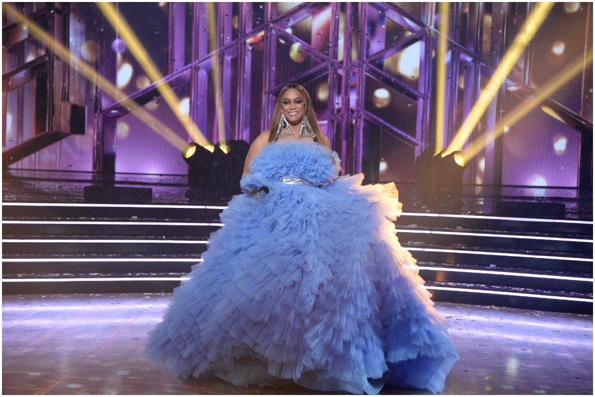Tyra Banks wearing a blue gown center stage at the 'Dancing With the Stars' finale.
