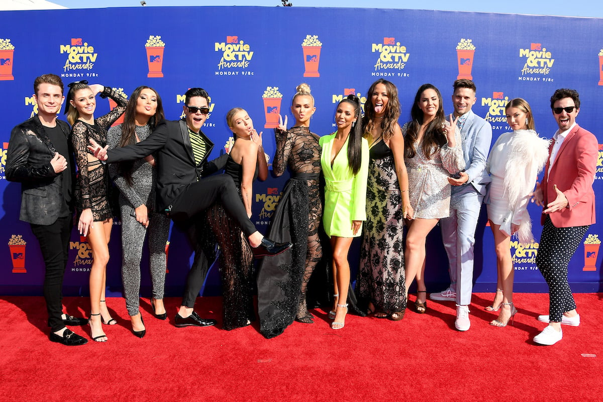 The cast of Vanderpump Rules strikes a silly pose on the red carpet.