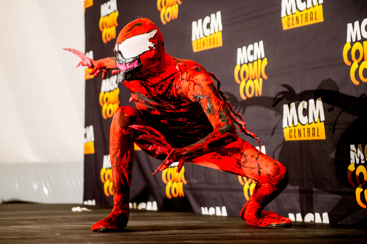 Cosplayer as the symbiote Spider-Man villains Carnage and Cletus Kasady