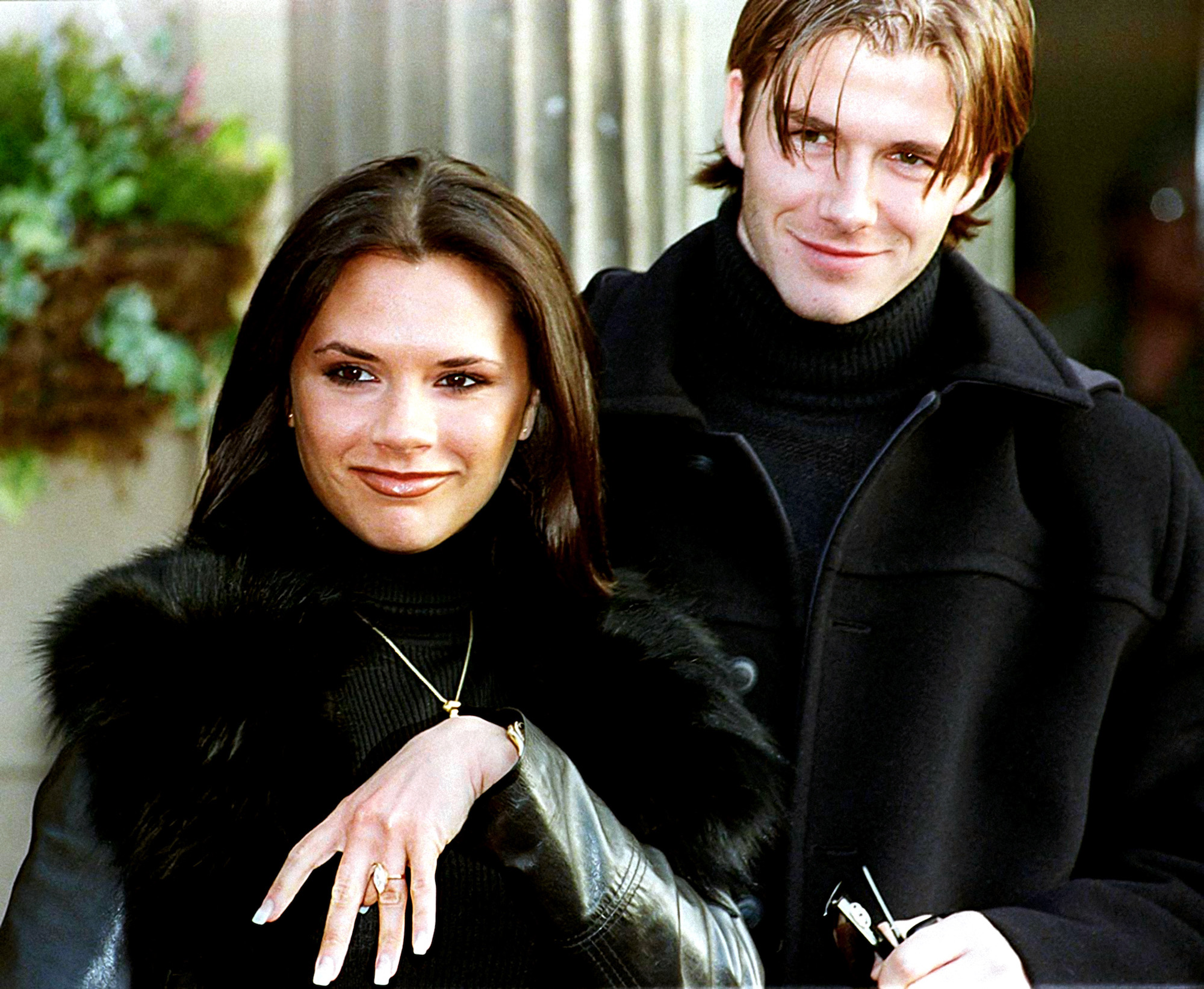 Victoria and David Beckham posing together after announcing their engagement