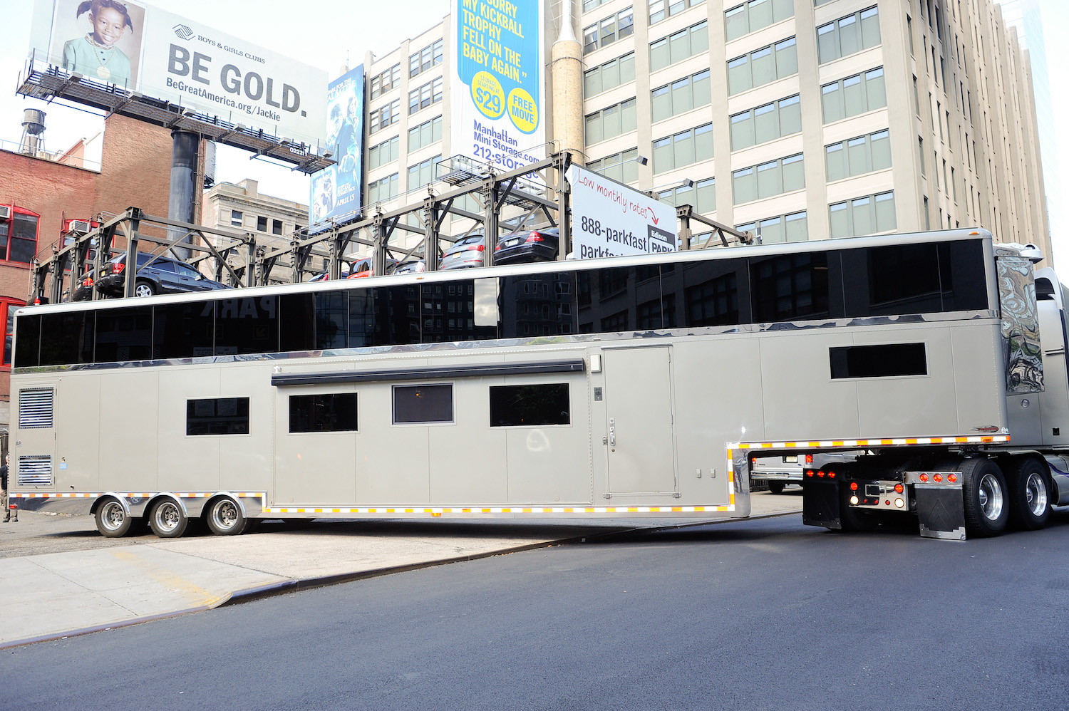 Will Smith's silver trailer turns down a street in a New York City, New York