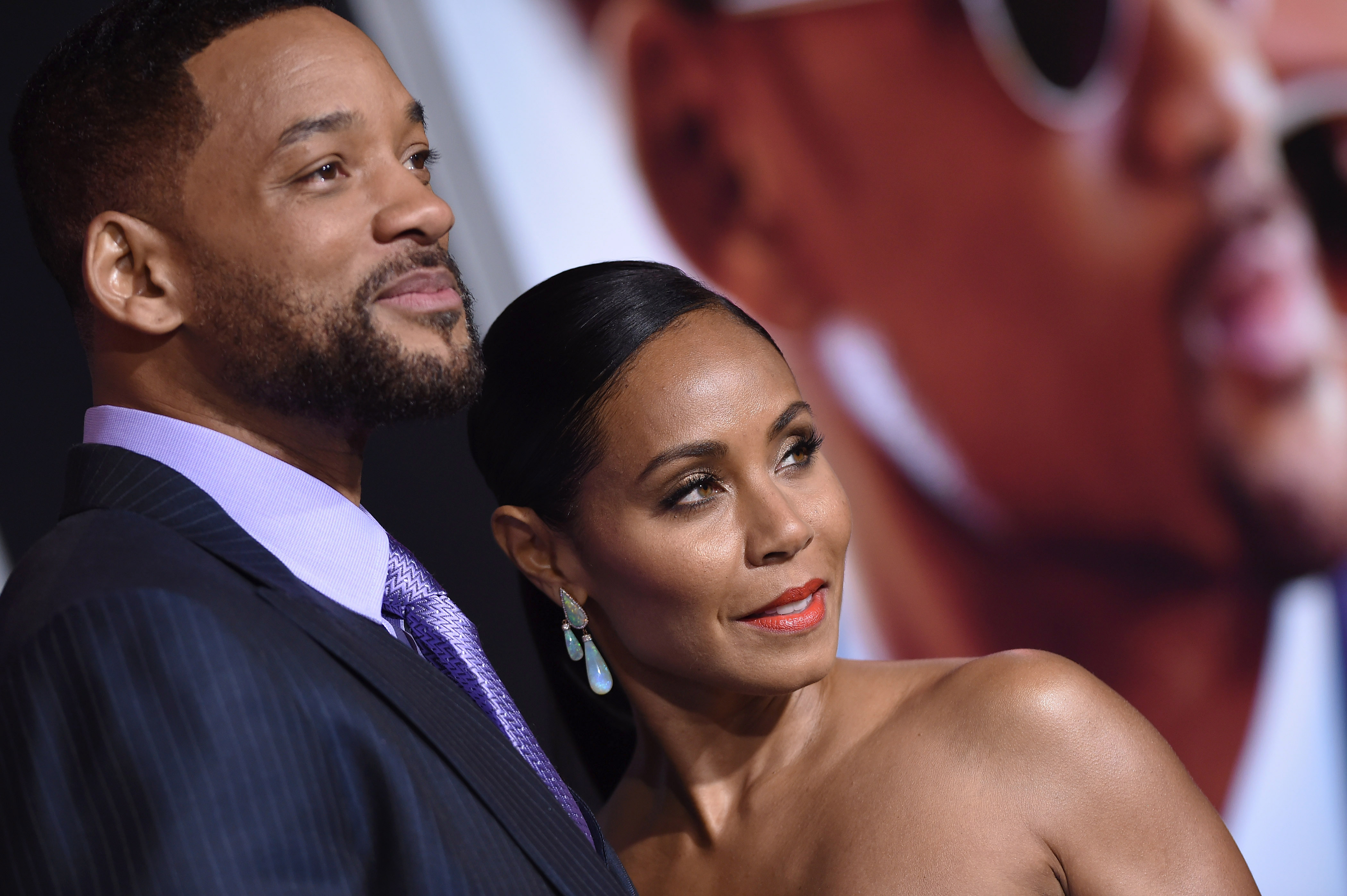 Will Smith and Jada Pinkett Smith pose together on the red carpet.
