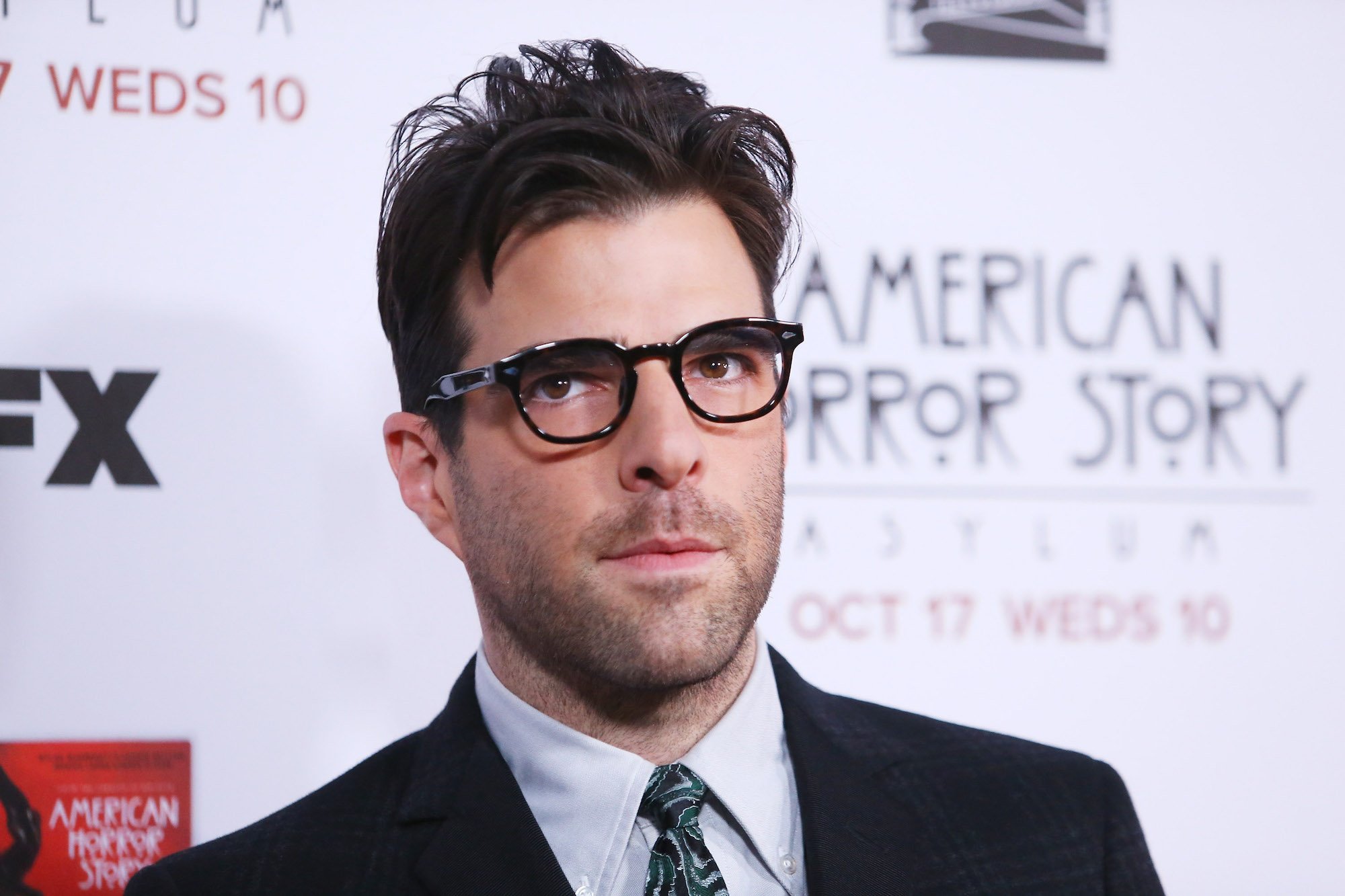 Zachary Quinto wearing a black suit to the 'American Horror Story: Asylum' Los Angeles Premiere.