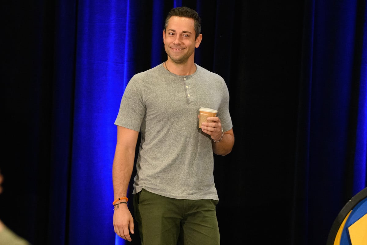 Zachary Levi with blue background.