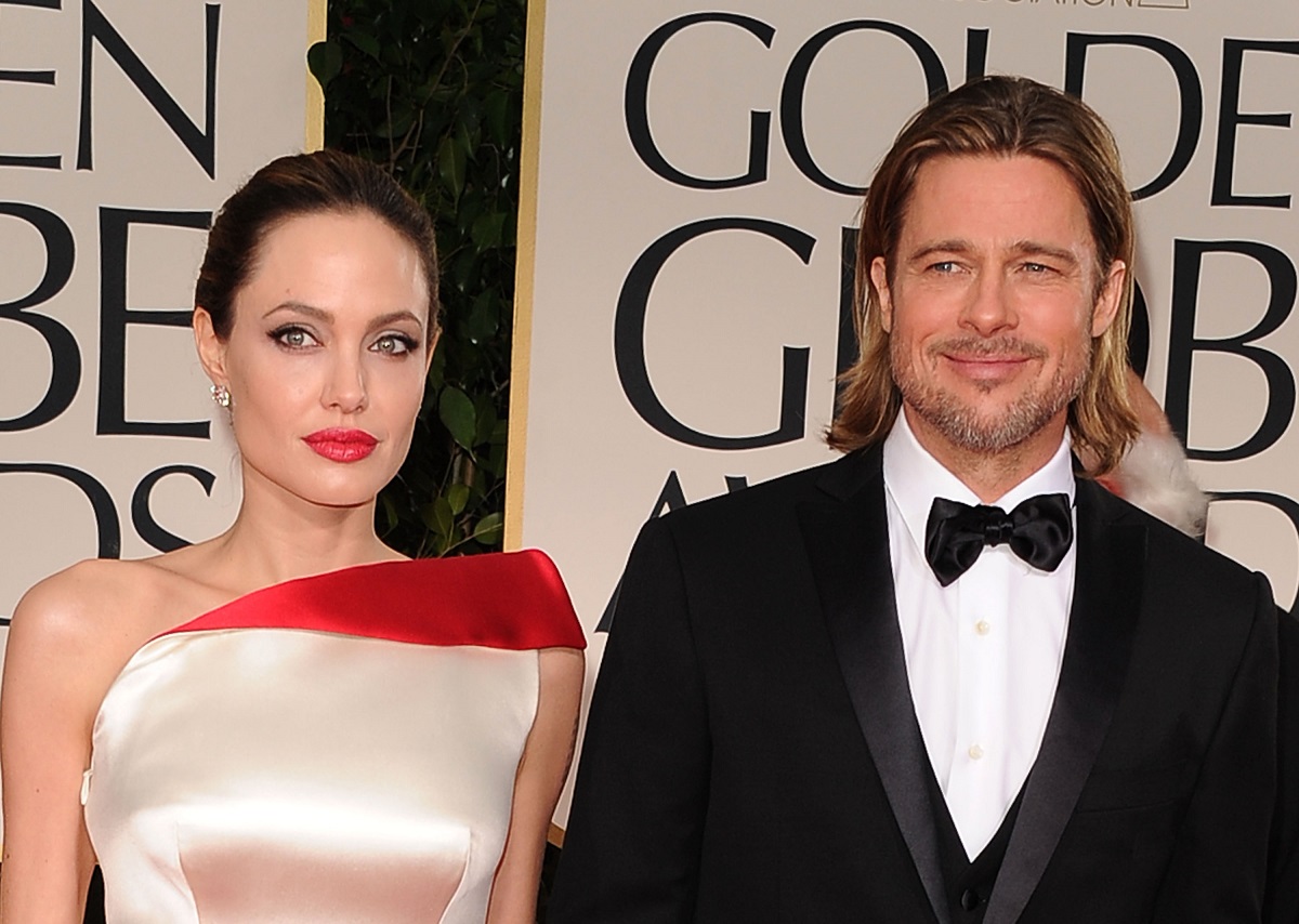 (L-R) Angelina Jolie and Brad Pitt arrive at the 69th Annual Golden Globe Awards on January 15, 2012, in Beverly Hills, California.