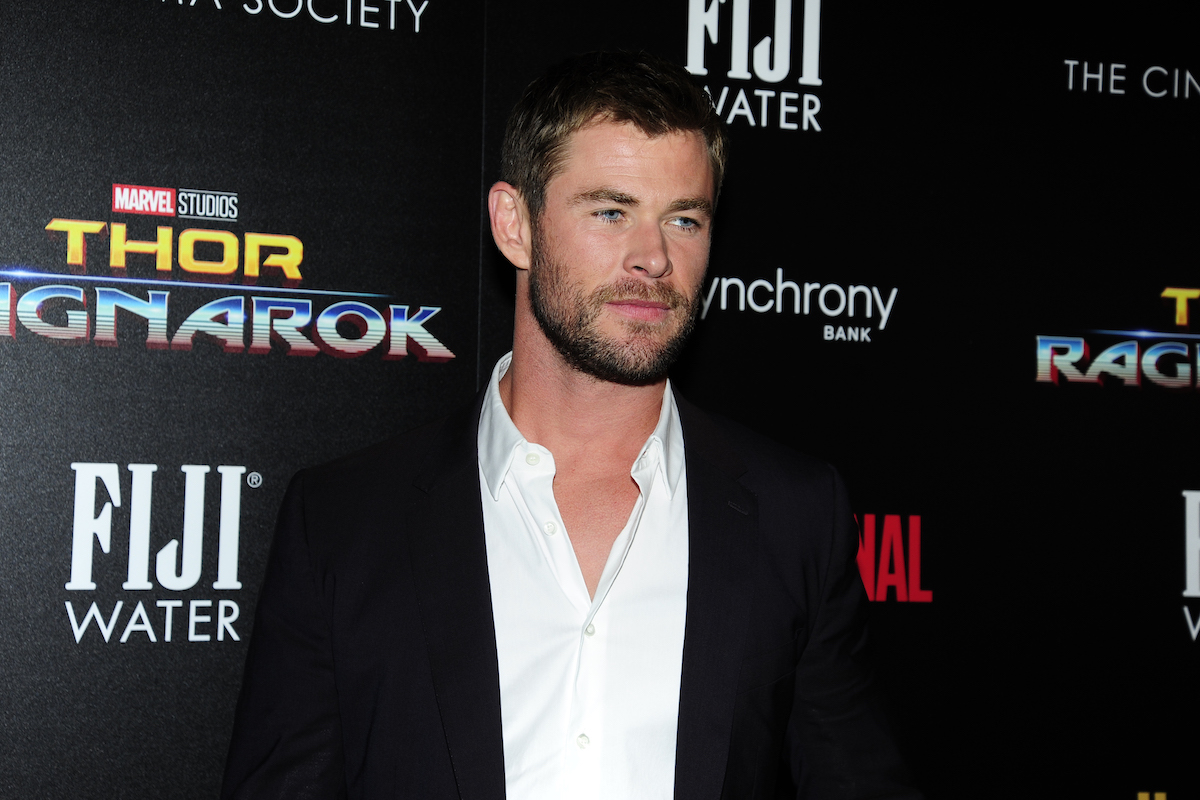 Chris Hemsworth in front of Thor: Ragnarok background