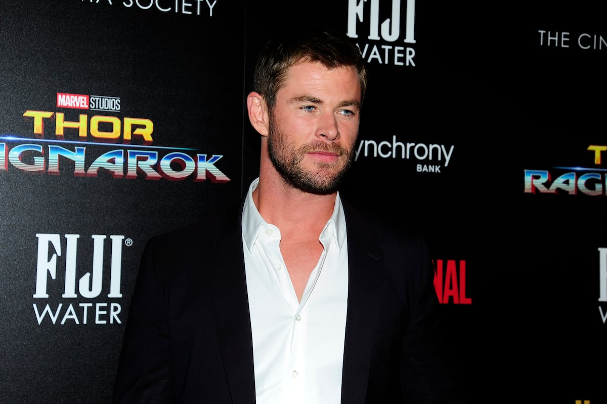 Chris Hemsworth in front of Thor: Ragnarok background