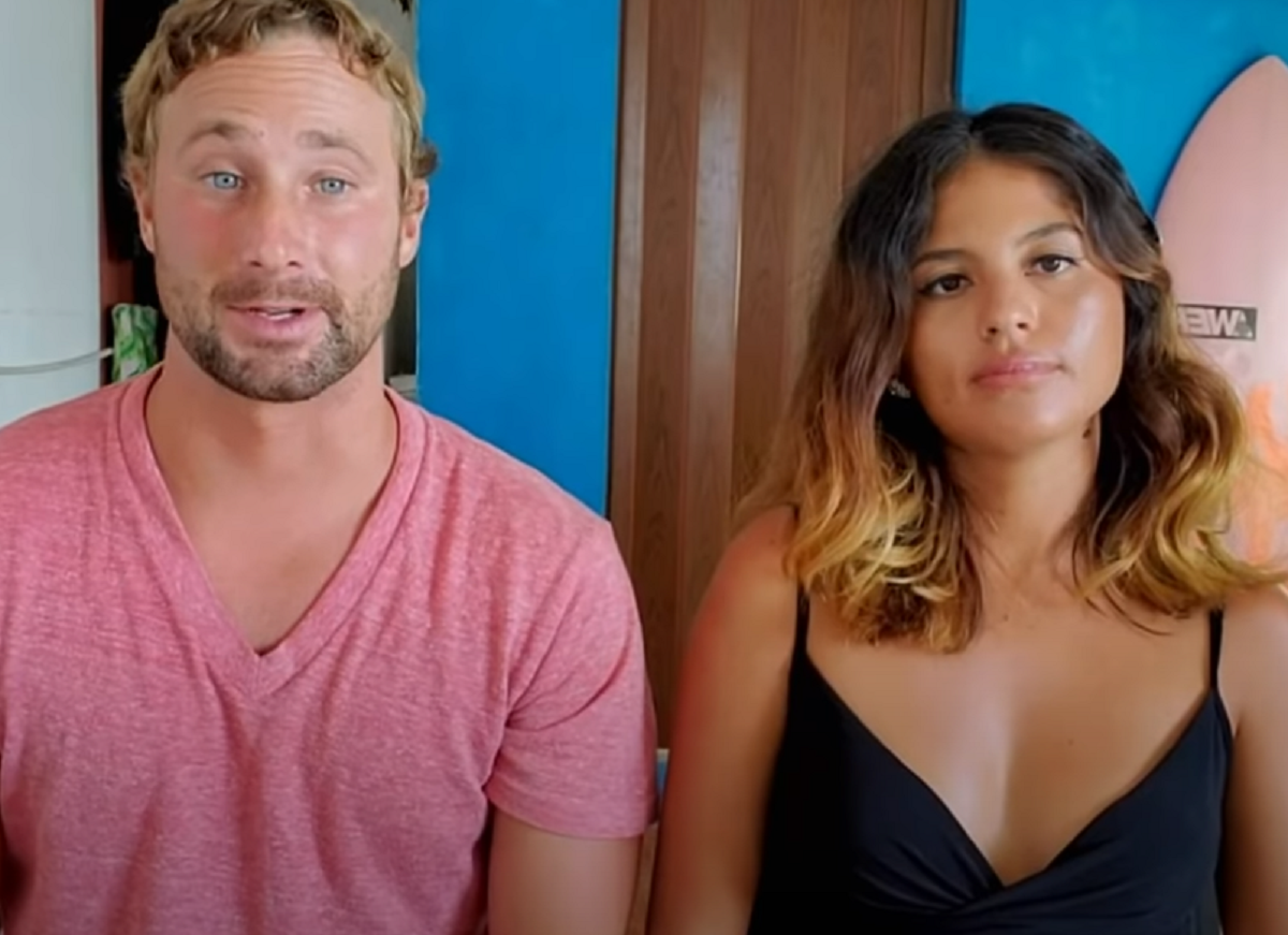 90 Day Fiancé stars Corey and Evelin -- Corey Rathgeber sits next to a displeased looking Evelin Villegas