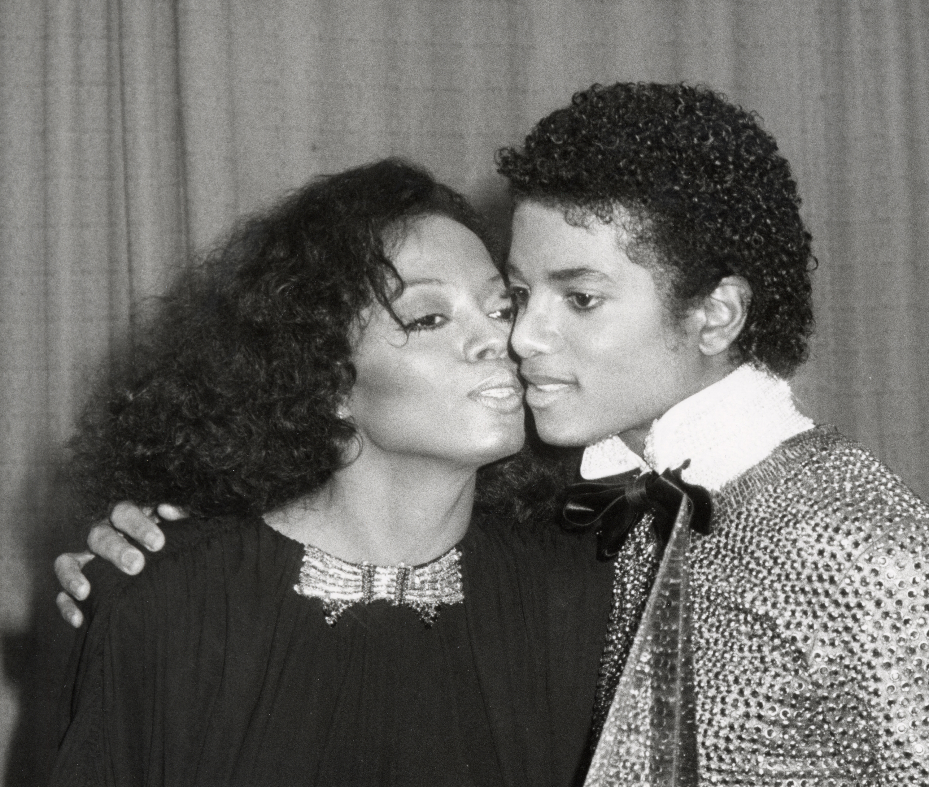 Diana Ross putting her face very close to Michael Jackson's