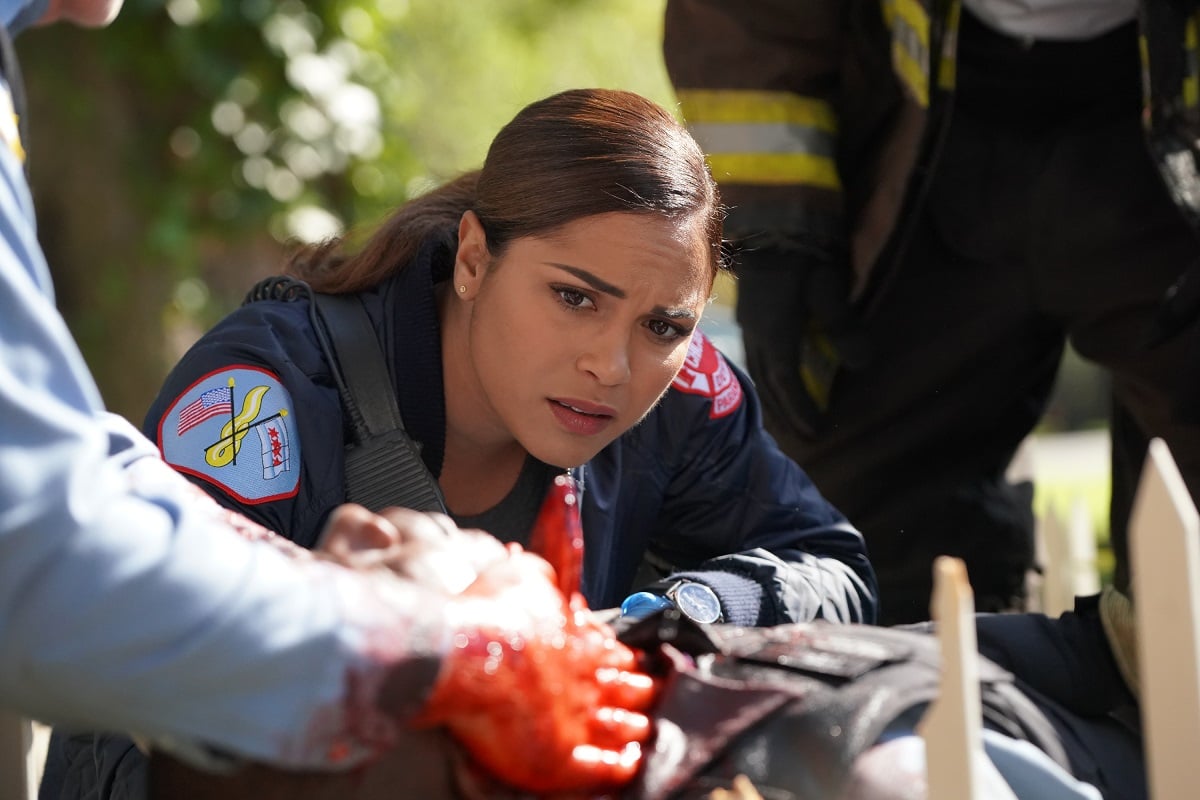 Monica Raymund as Gabriela Dawson on Chicago Fire -- Dawson furrows her brow while treating a patient