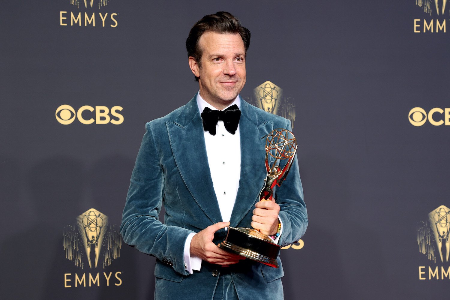 Jason Sudeikis, winner of the 2021 Emmy for Outstanding Lead Actor in a Comedy Series for 'Ted Lasso,' poses in the press room with his award.