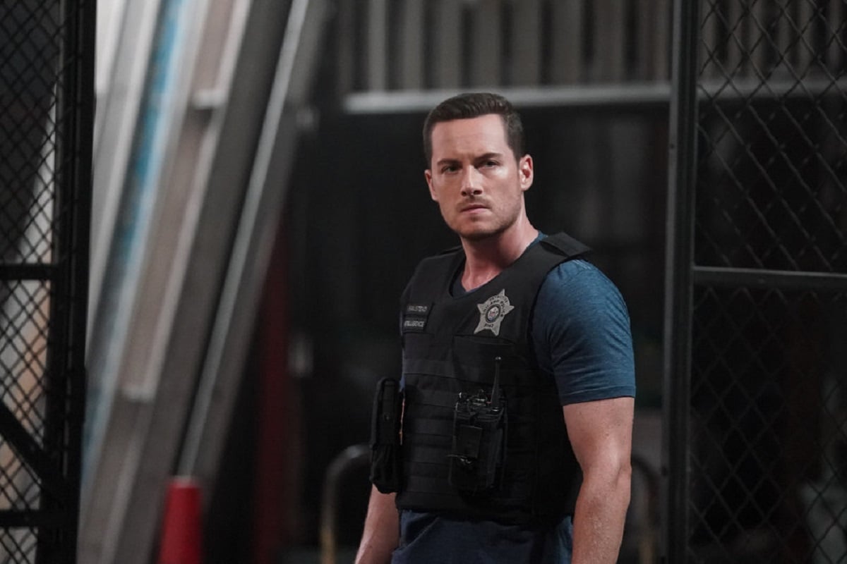 Chicago P.D. Season 9: Jesse Lee Soffer as Jay Halstead -- Halstead glares moodily into the distance while wearing  a tactical vest.
