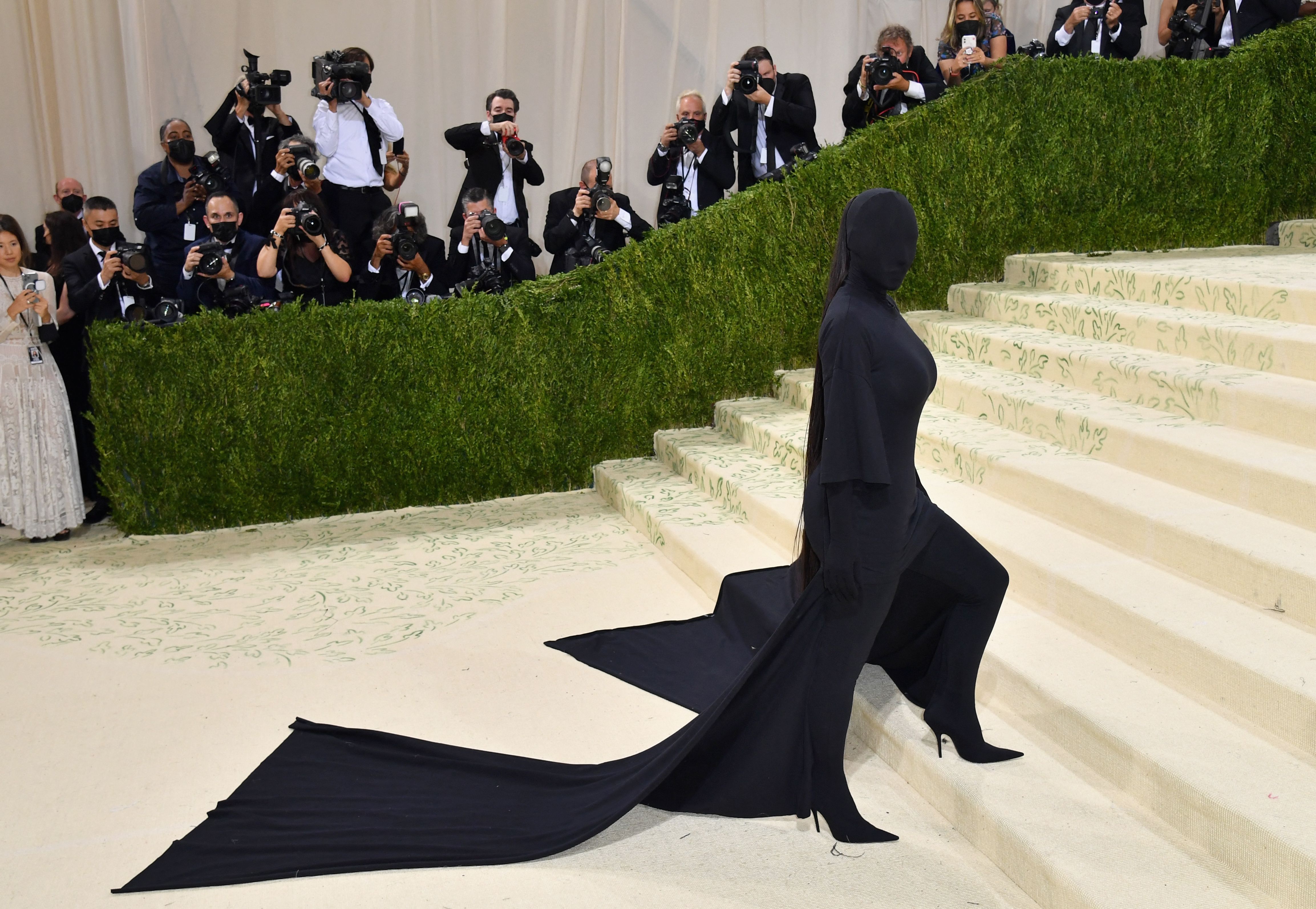 Kim Kardashian walking up the stars of the Met Gala 2021