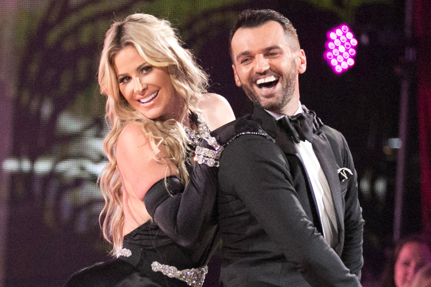 Kim Zolciak-Biermann smiling with her dance partner Tony Dovolani