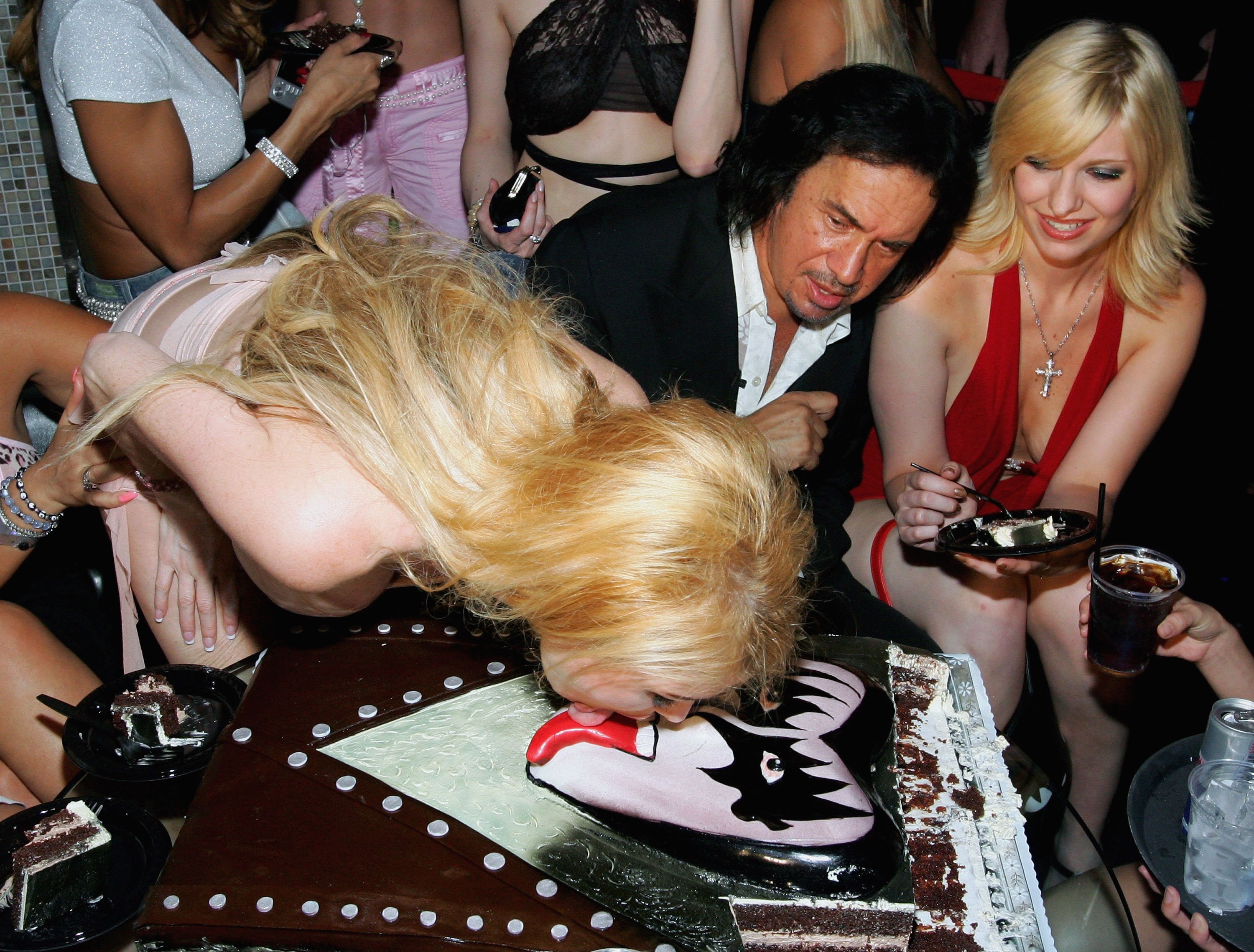Taylor Wane licking Kiss' Gene Simmons' birthday cake