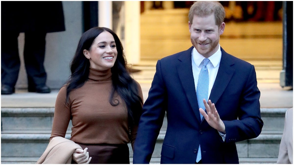 Meghan Markle and Prince Harry pose for a royal photo op.