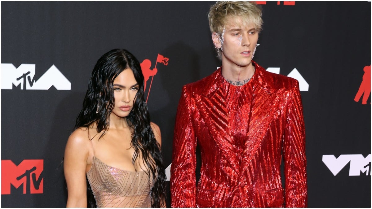 Meghan Fox and Machine Gun Kelly pose on the MTV VMA's red carpet.