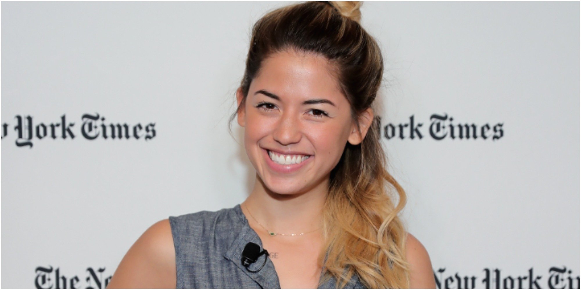 Molly Yeh smiles in front of a white background