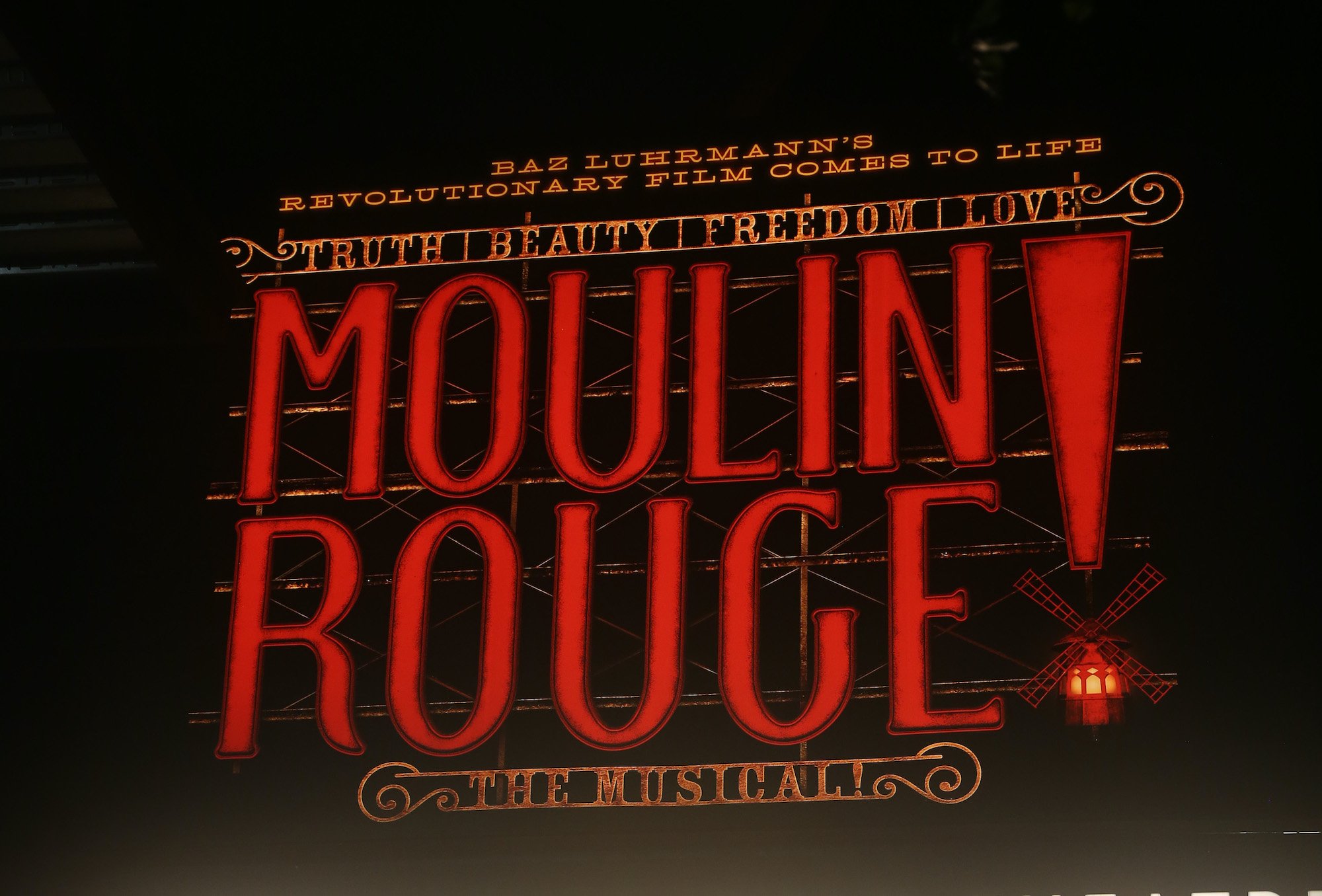 Signage at the re-opening night of 'Moulin Rouge! The Musical' on Broadway on Sept. 24, 2021 in New York City. The sign is large with red lettering that says 'MOULIN ROUGE! The Musical!' 'Truth, Beauty, Freedom, Love,' and 'Baz Luhrmann's revolutionary film comes to life.' 'Moulin Rouge! The Musical' is based on Baz Luhrmann's 2001 'Moulin Rouge!' movie starring Nicole Kidman and Ewan McGregor. And the 'Moulin Rouge!' Tony Awards prove the story is still beloved 20 years later.