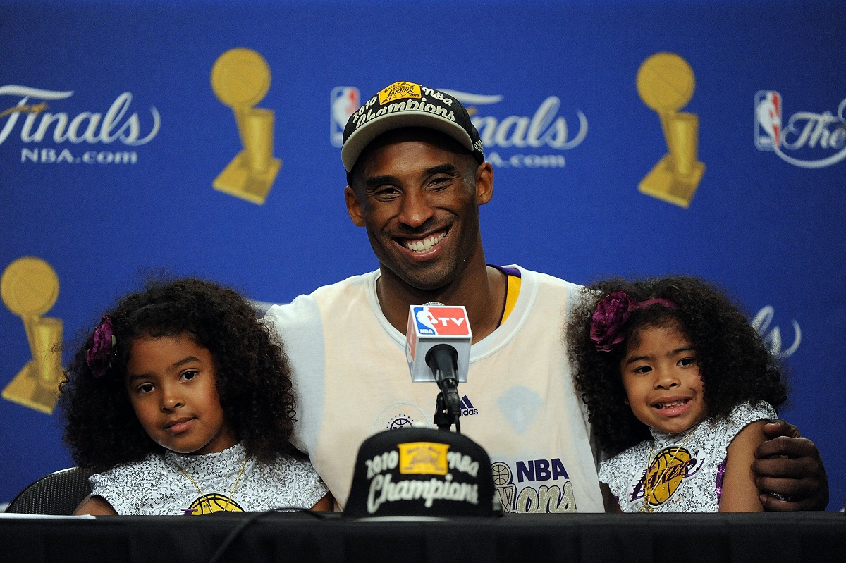 Kobe Bryant (C) speaks during the post-game news conference with daughters Natalia (L) and Gianna Bryant (R) on June 17, 2010, in Los Angeles, California.