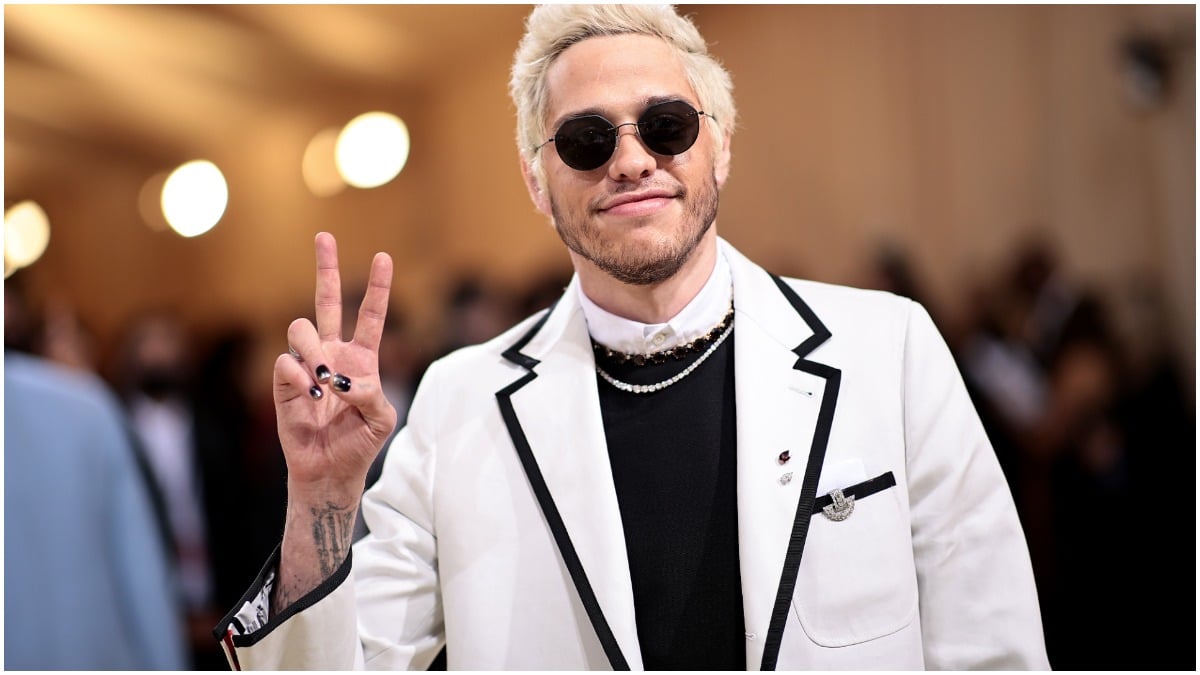 Pete Davidson in his self-proclaimed "slutty nun" outfit, makes a peace sign on the Met Gala red carpet.