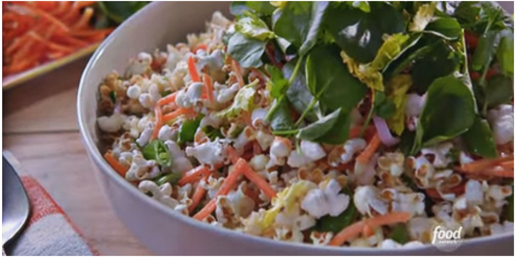 Molly Yeh pairs salty popcorn, crunch veggies and a creamy topping for her midwestern popcorn salad.