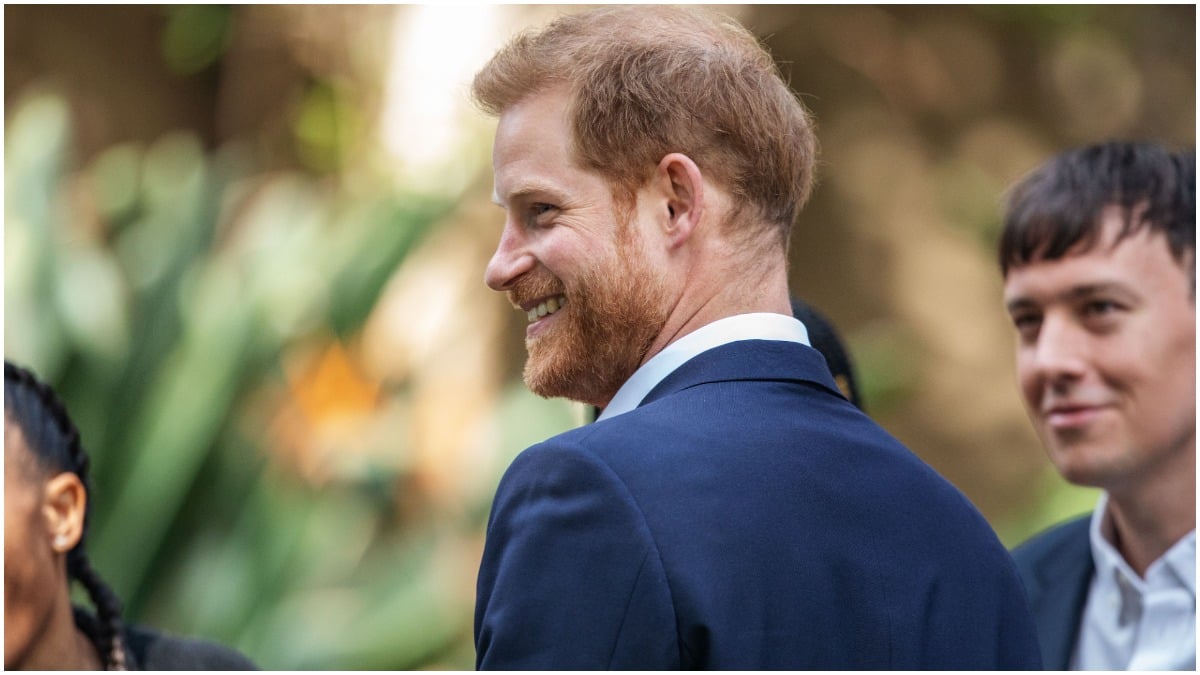 Prince Harry poses for photographers at a royal event.