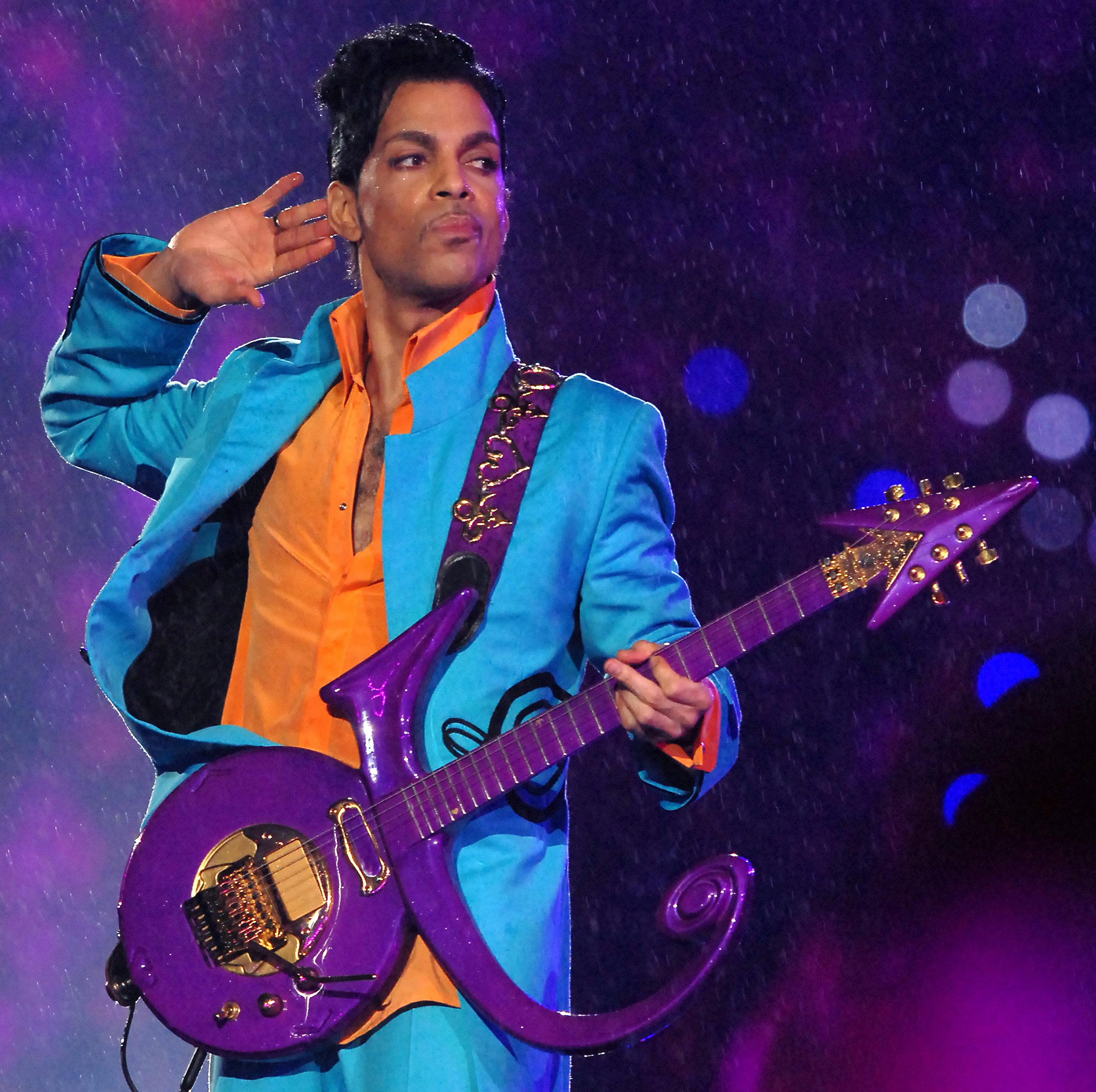 Prince with a purple guitar