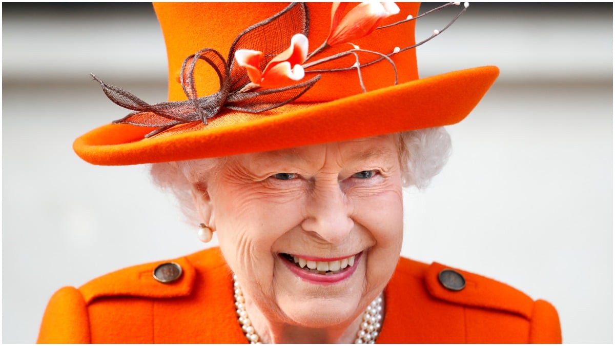 Queen Elizabeth II Queen Elizabeth II smiles in an orange hat in 2019
