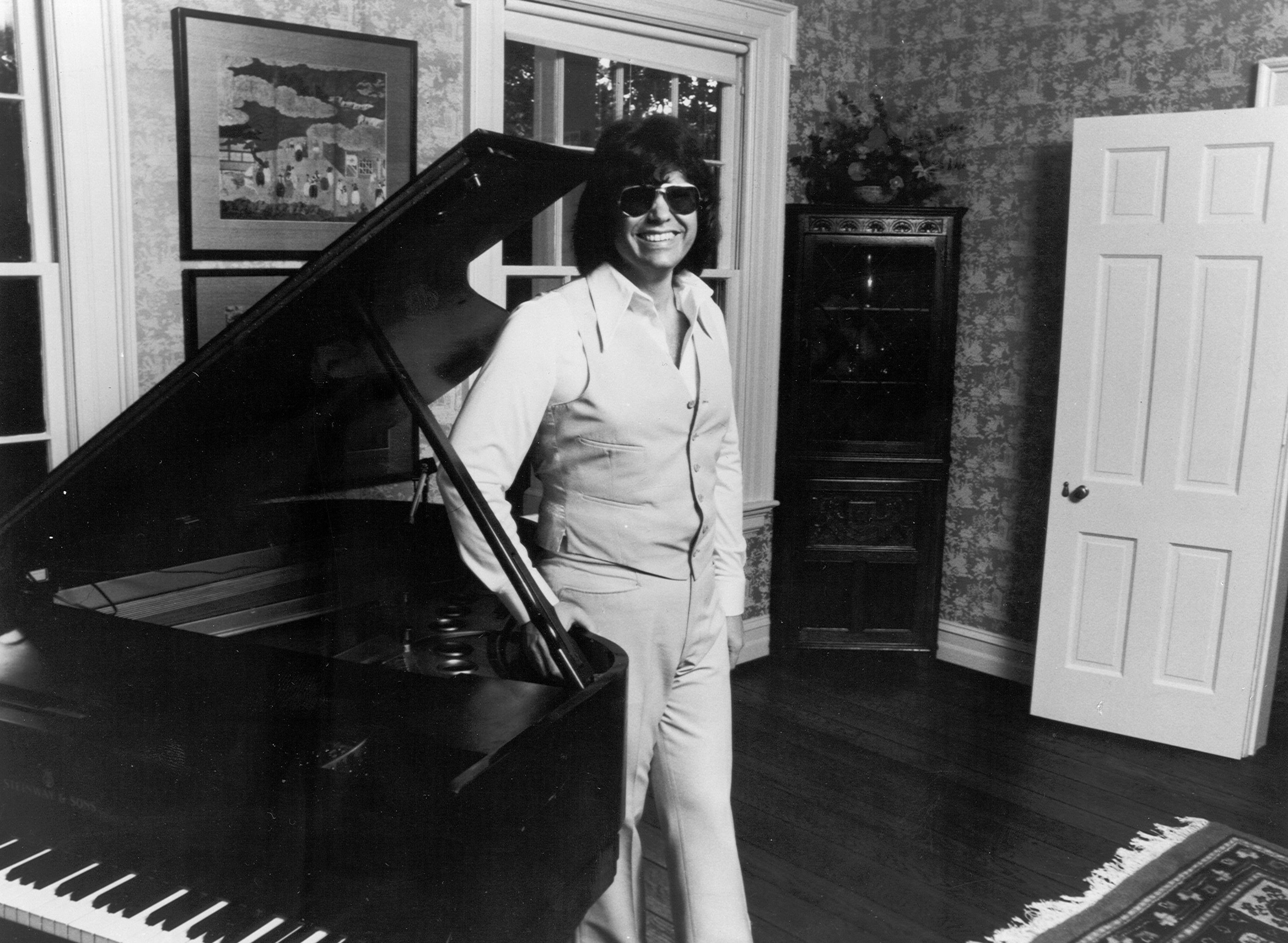 Ronnie Milsap with a piano