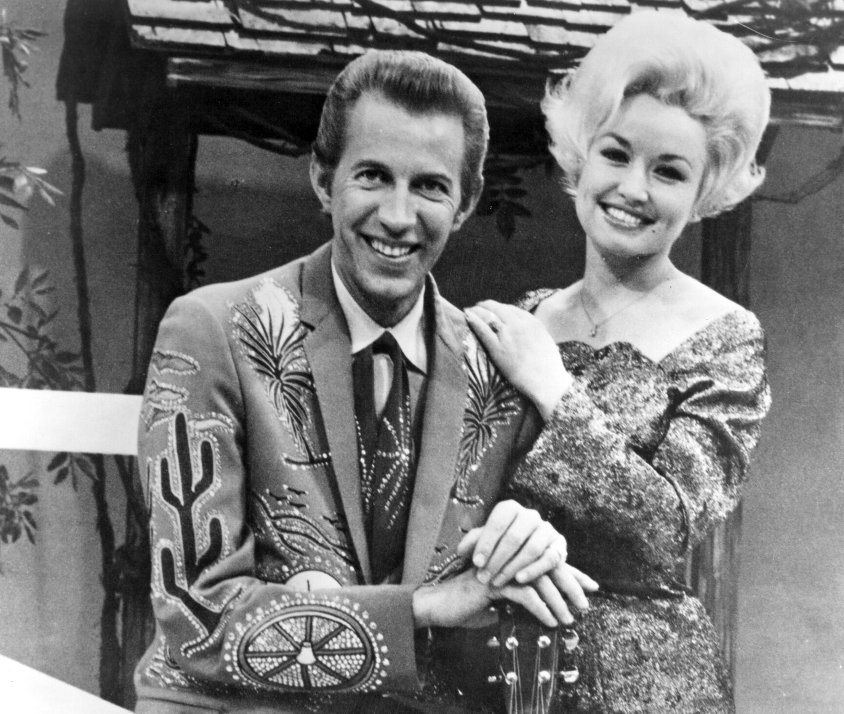 Country singer Dolly Parton with her collaborator Porter Wagoner on the set of his TV show in 1967.