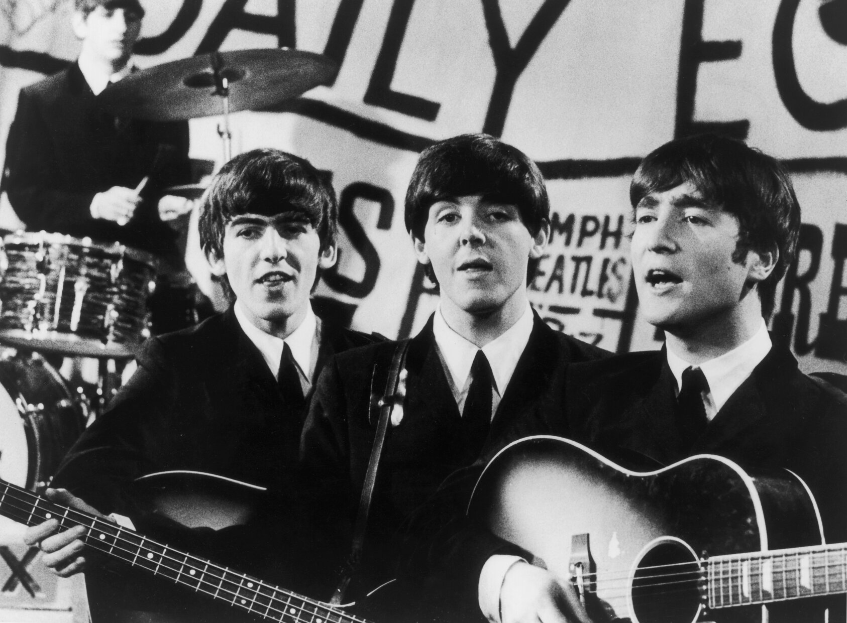 The Beatles in performance in 1963, from left to right; Ringo Starr, George Harrison, Paul McCartney and John Lennon