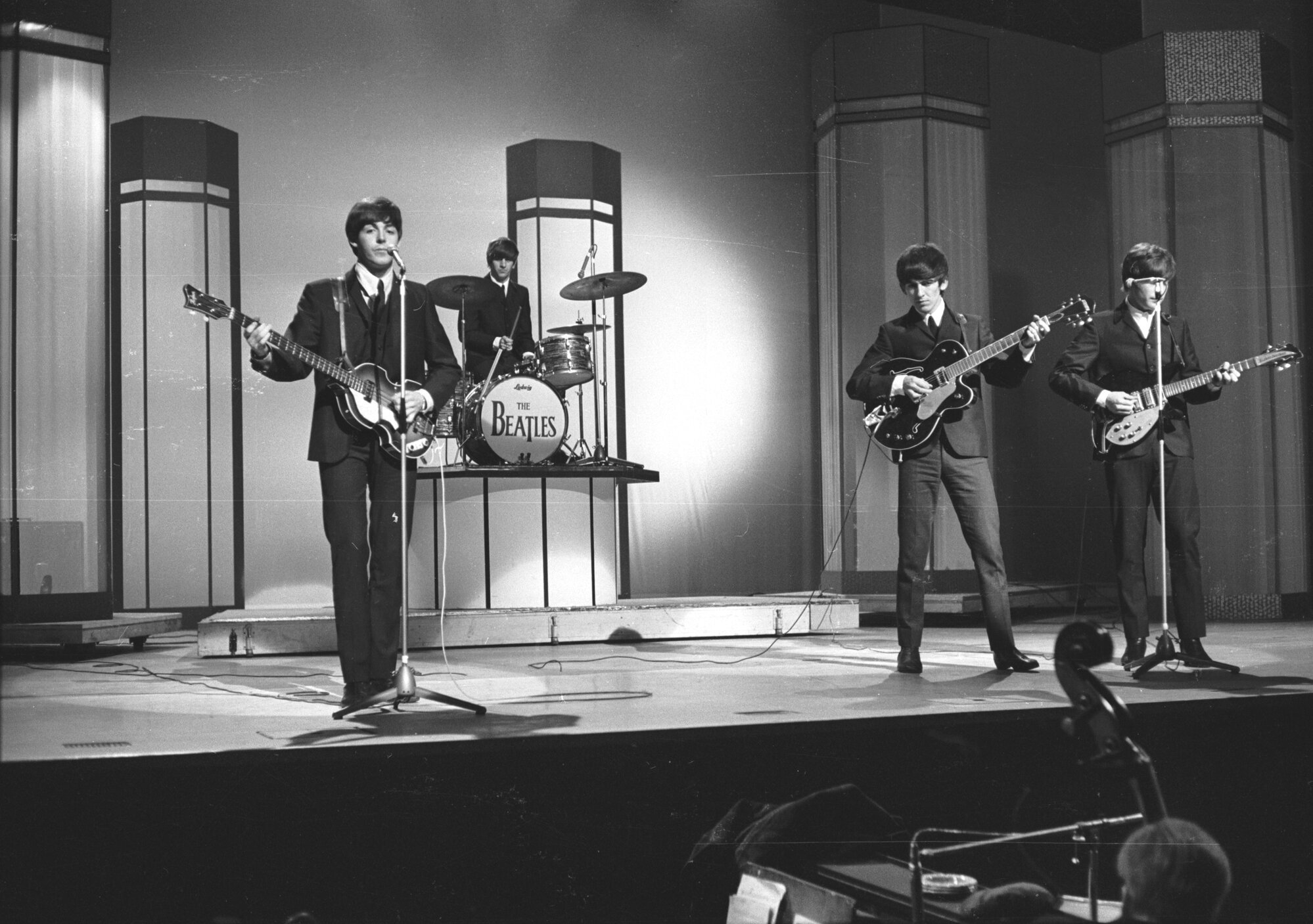 The Beatles, from left to right: Paul McCartney, Ringo Starr, George Harrison, and John Lennon in concert at the London Palladium.