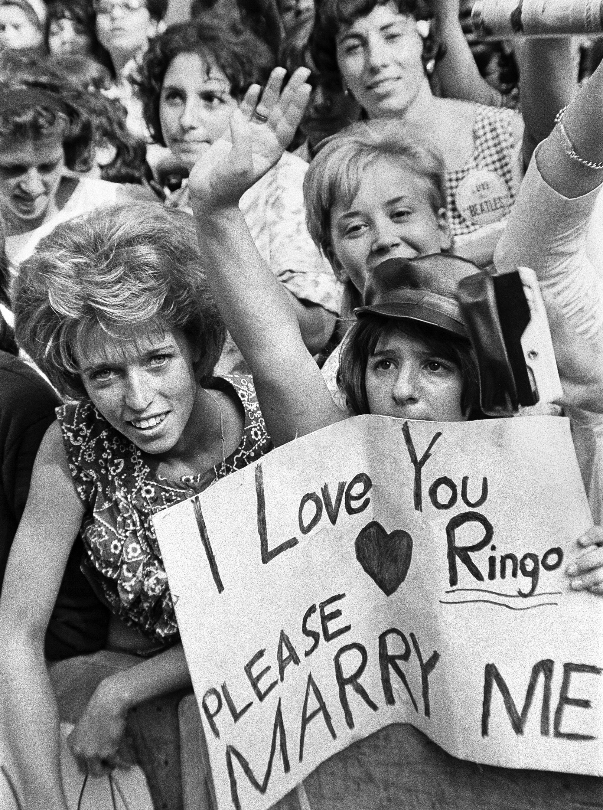 The Beatles fans in New York City. A fan holds a sign that says 'I love you Ringo. Please marry me!'