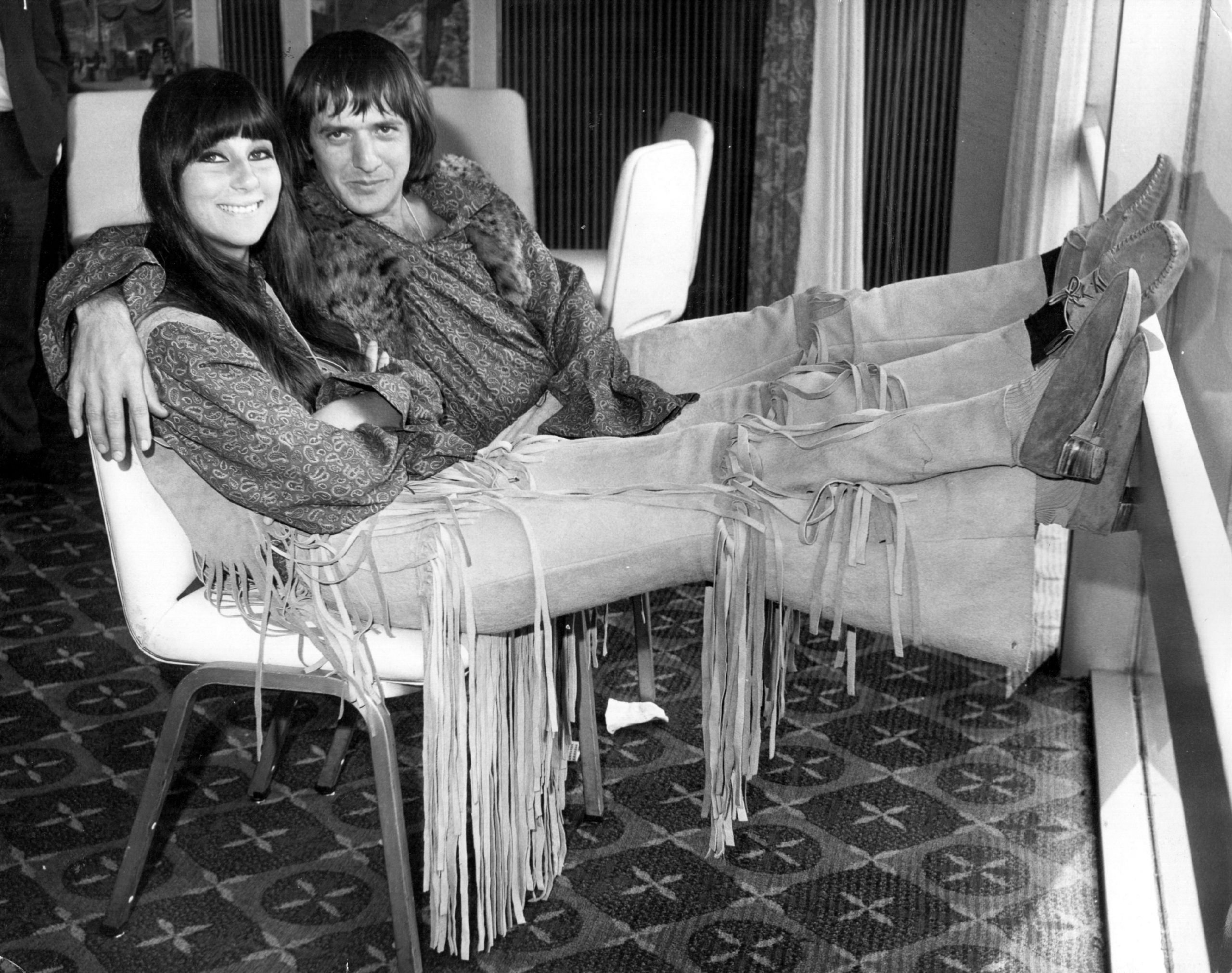 Sonny & Cher on a chair