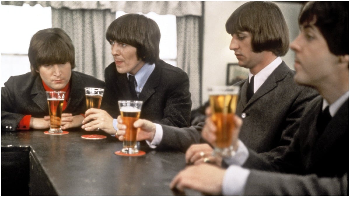 The Beatles drink a beer in a still from their movie 'Help!' which was released in 1965. (L-R) John Lennon, George Harrison, Ringo Starr and Paul McCartney. 