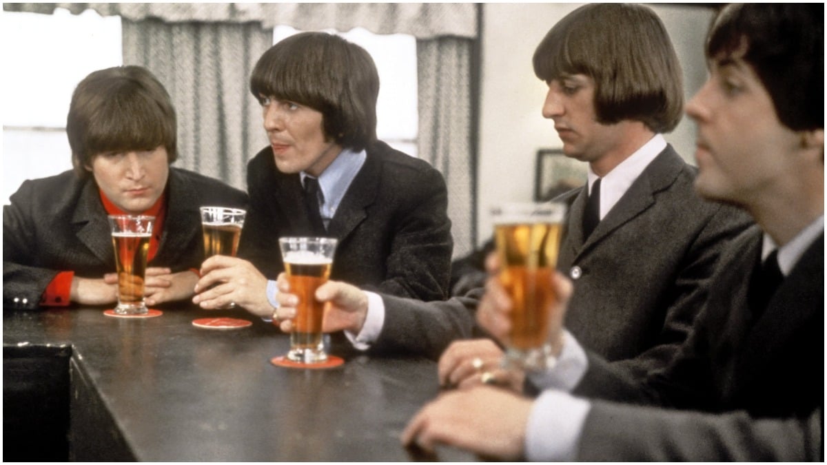 The Beatles drink a beer in a still from their movie 'Help!' which was released in 1965. (L-R) John Lennon, George Harrison, Ringo Starr and Paul McCartney.