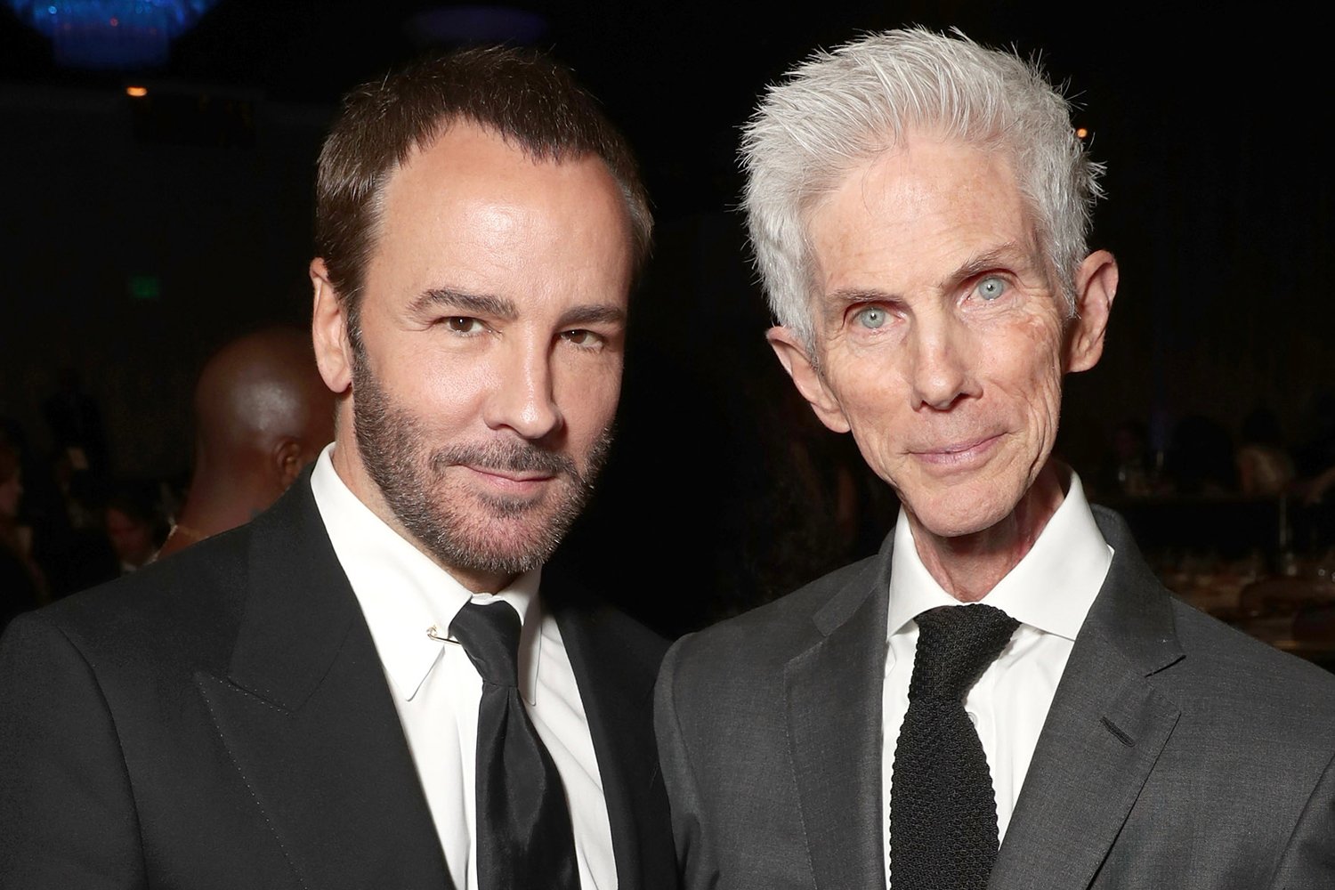 Tom Ford posing next to husband Richard Buckley