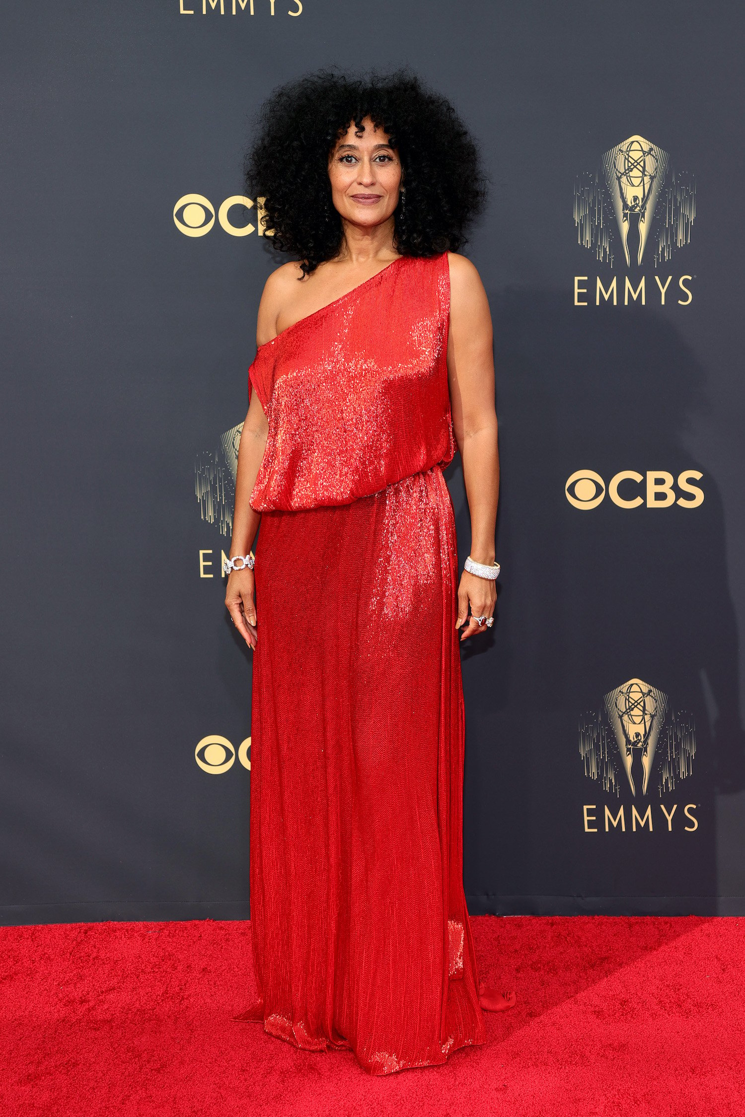 Tracee Ellis Ross wears a red gown on the 2021 Emmys red carpet