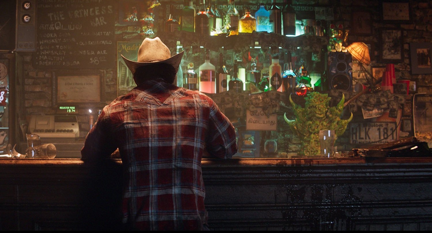 Insomniac Games' Wolverine trailer shows Logan sitting at a bar