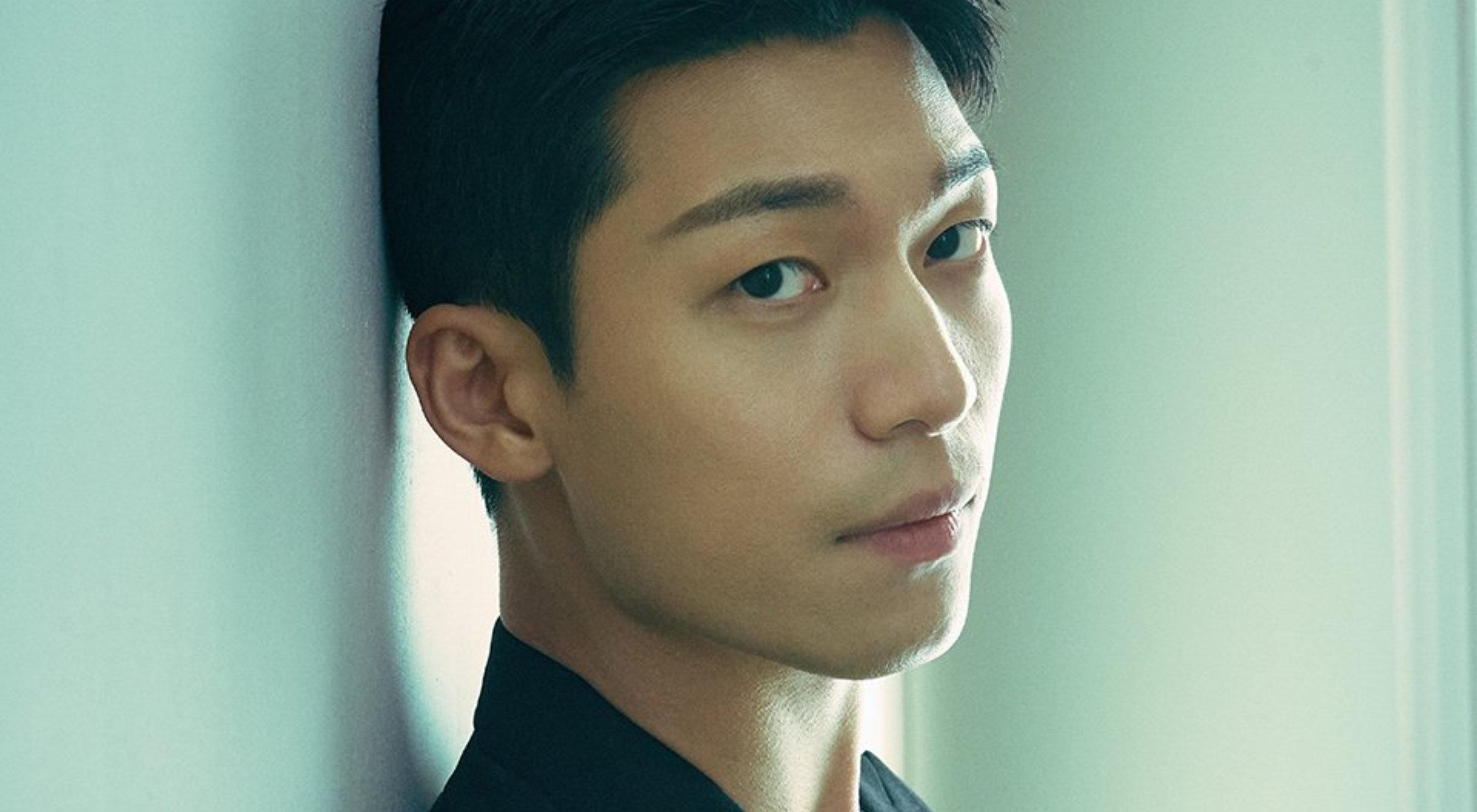 Actor Wi Ha-Joon as Hwang Jun-Ho for 'Squid Game' on Netflix wearing full black suit for photoshoot