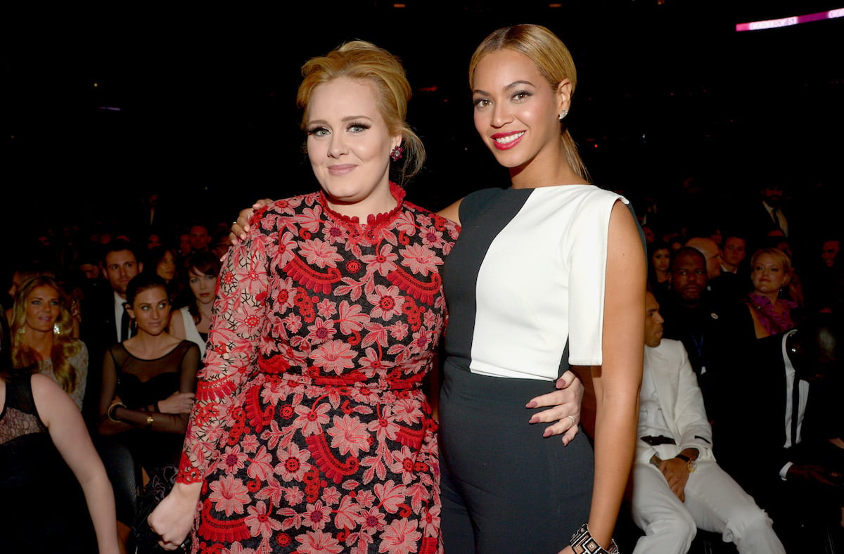 Adele and Beyonce pose together at an event.