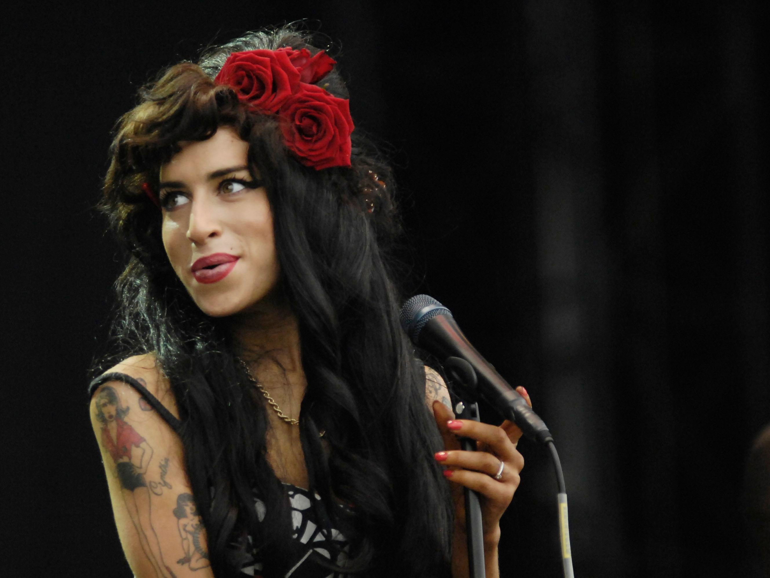 Amy Winehouse performing on stage