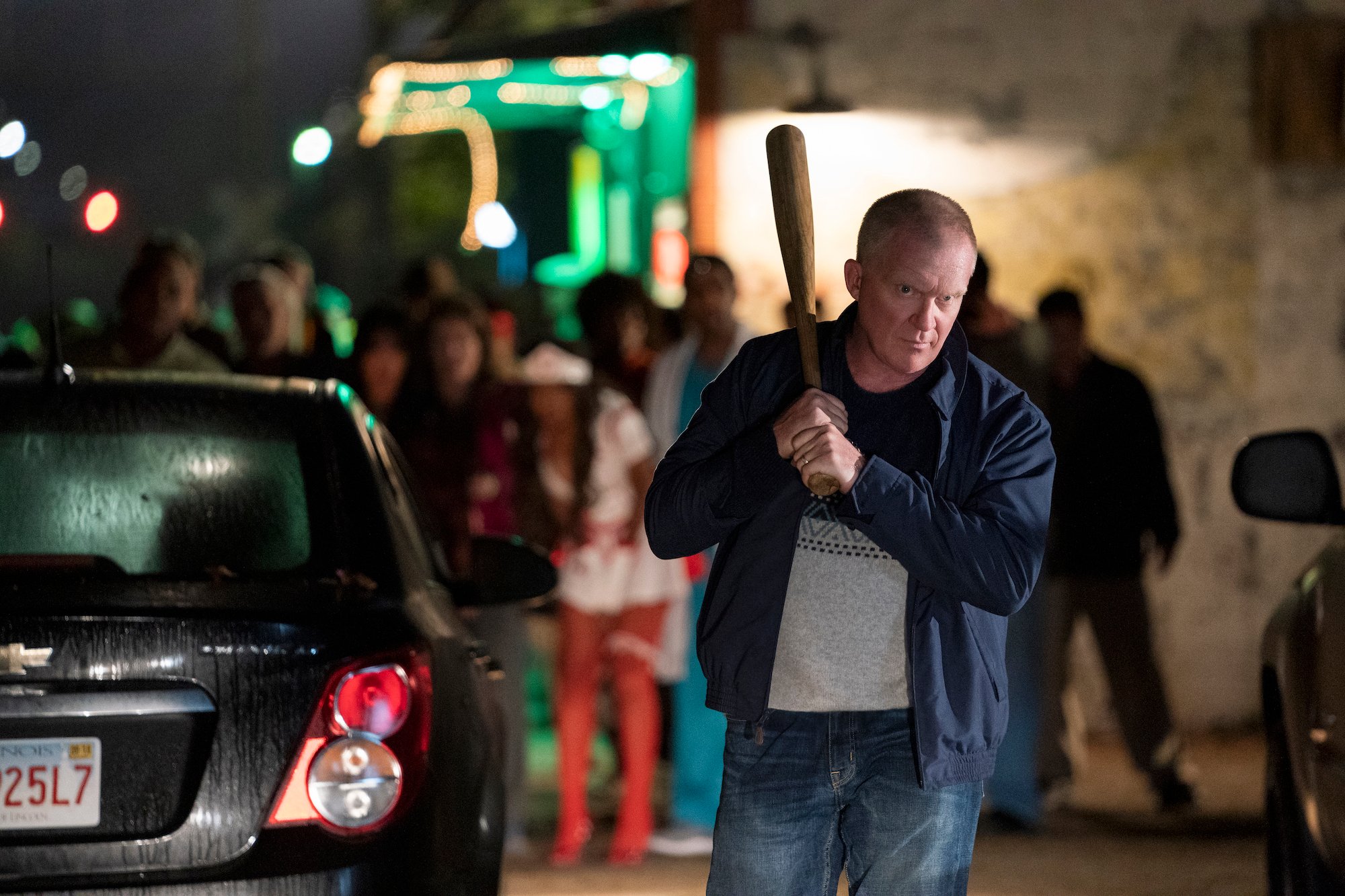 Anthony Michael Hall holds a baseball bat in Halloween Kills