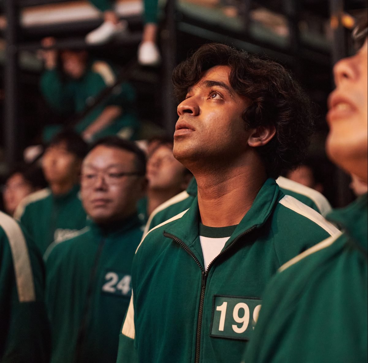 Anupam Tripathi wearing a green jumpsuit in 'Squid Game'