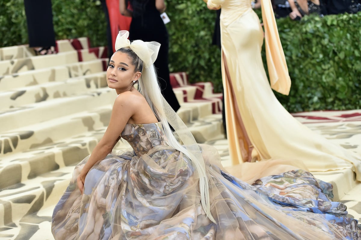 Ariana Grande crouched on the Met steps
