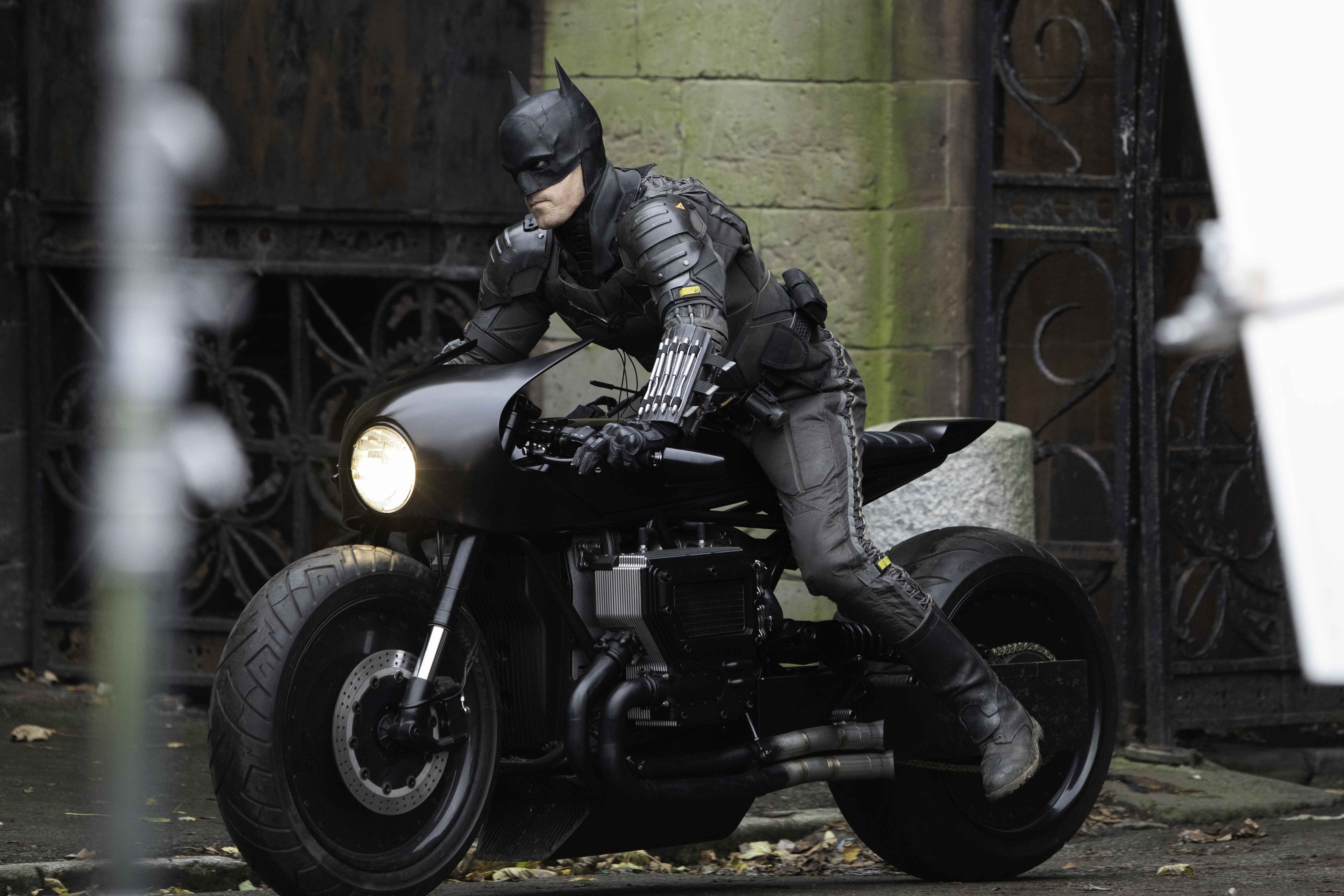 Robert Pattinson's stunt double for 'The Batman' wears the Batman costume and drives his motorcycle. A new trailer for 'The Batman' was released at DC FanDome 2021.